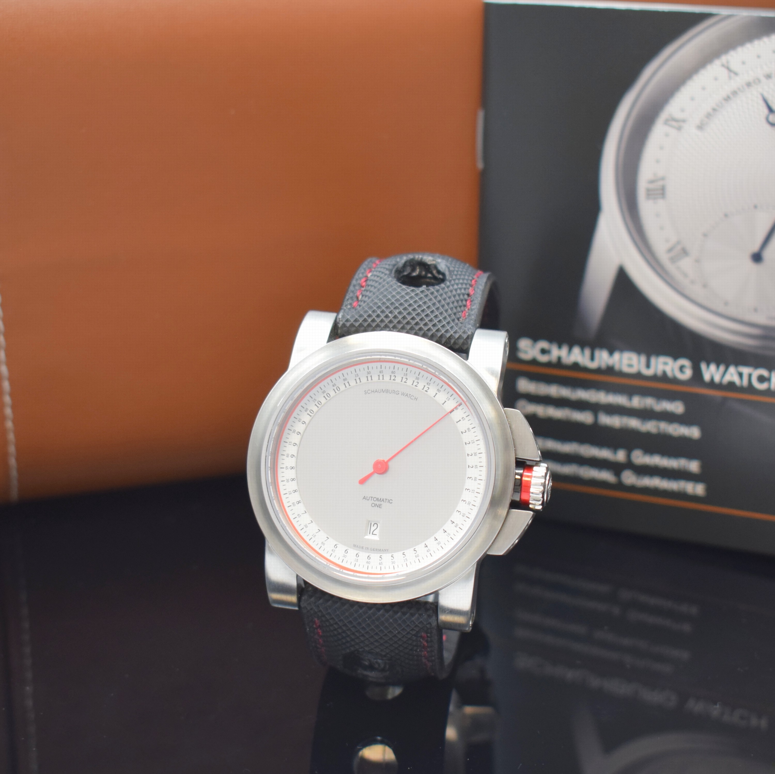 SCHAUMBURG WATCH Einzeiger-Armbanduhr GT-ONE Referenz 011, Automatik, beids. vergl. Edelstahlgeh. inkl. Leder-/Textilband m. dopp.Faltschl., Boden ...
