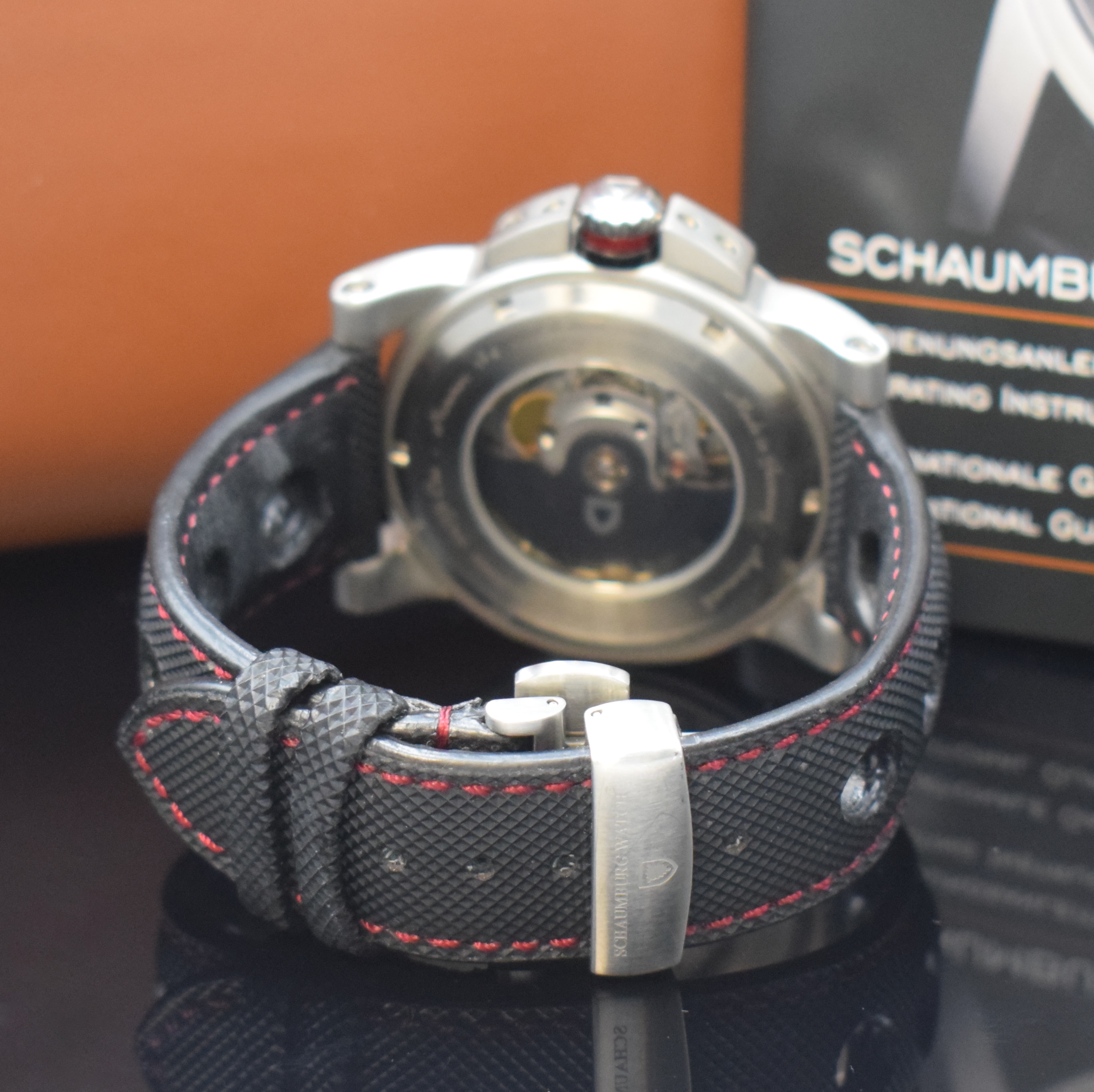 Detail b: SCHAUMBURG WATCH Einzeiger-Armbanduhr GT-ONE Referenz 011, Automatik, beids. vergl. Edelstahlgeh. inkl. Leder-/Textilband m. dopp.Faltschl., Boden ...