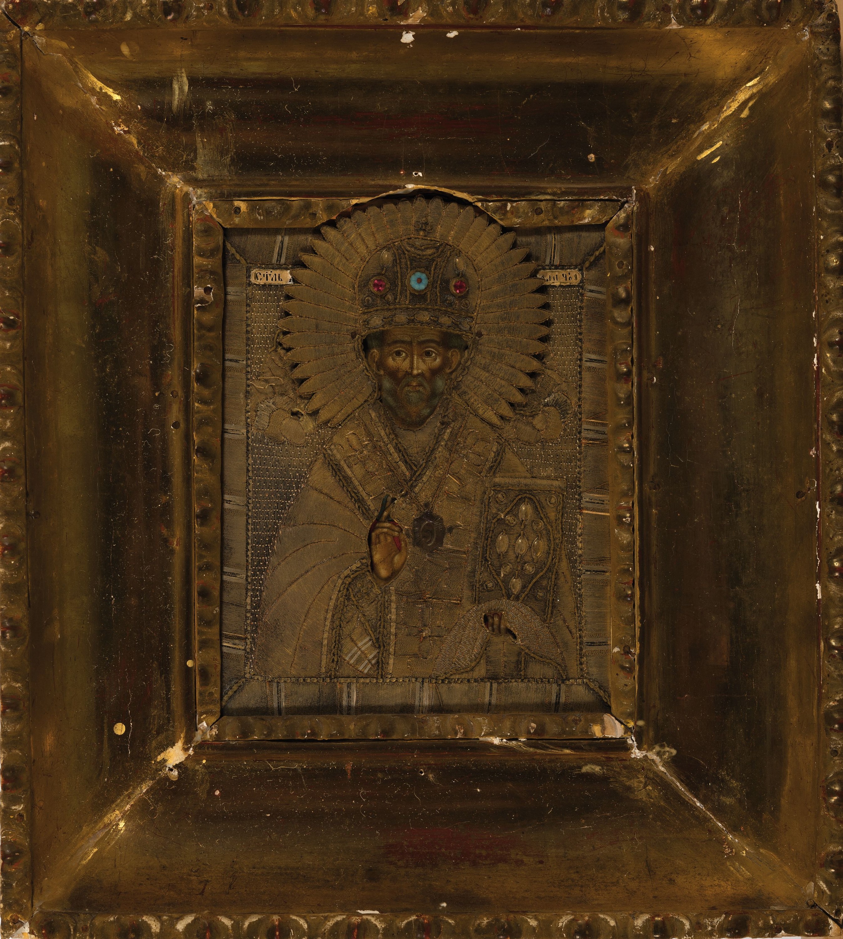 Ikone, Russland, um 1880,, Hl. Nikolaus, Eitempera/Holz, Oklad aus, Textil, goldfarbeneFäden und verg. Metallapplikationen, gestickt Krone mit ...