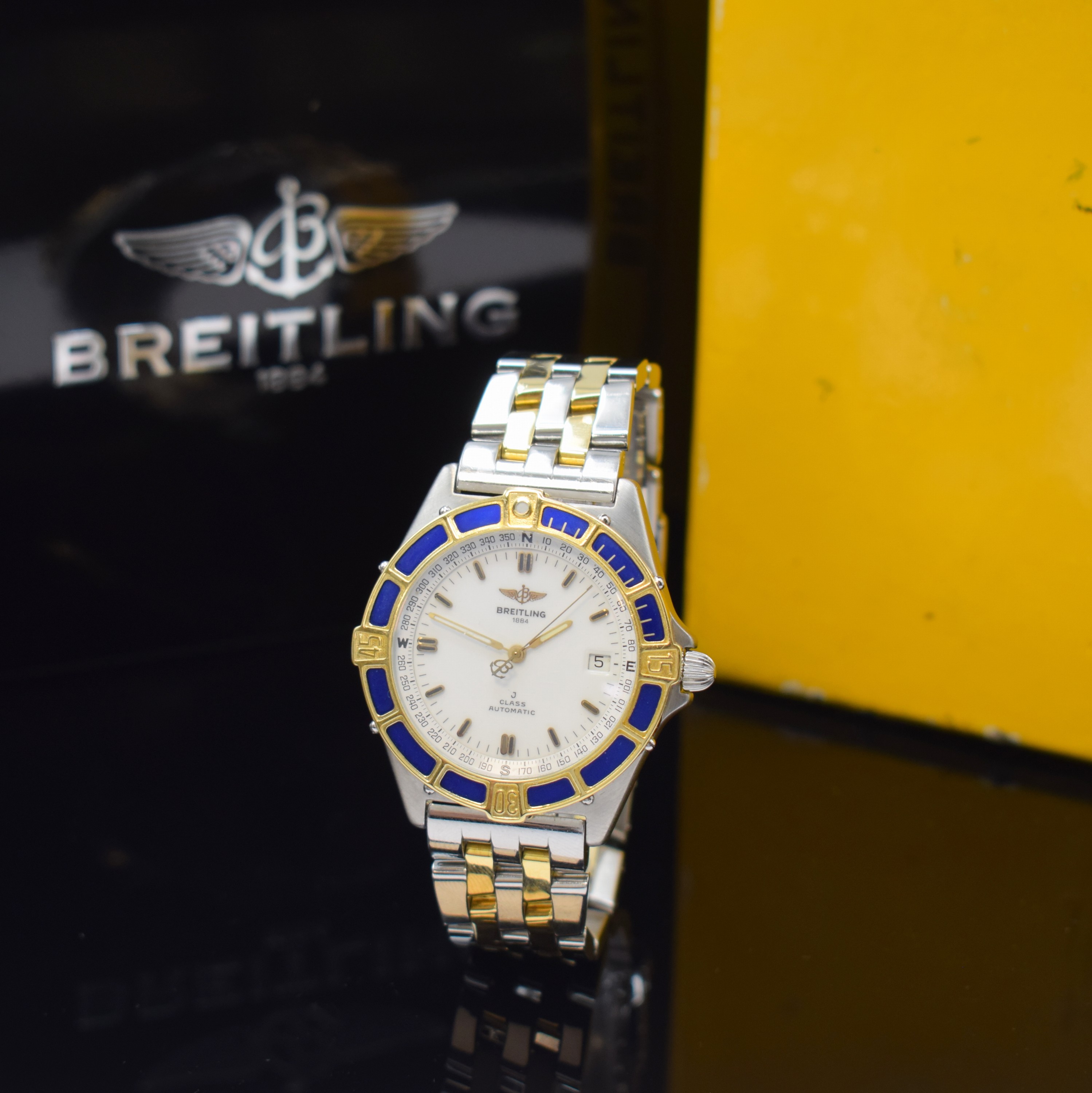 BREITLING J-Class Herrenarmbanduhr in Stahl/Gold Referenz 80250, Schweiz um 1995, Automatik, Boden und Krone verschr., Pilotband m. Faltschl., ...