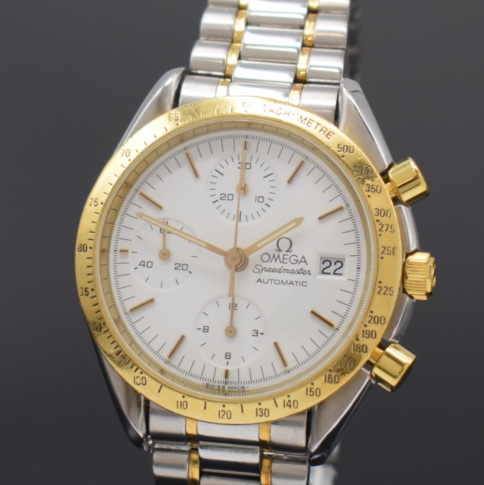 Detail a: OMEGA Speedmaster Herrenarmbanduhr mit Chronograph Referenz 175.0043/375.0043, Schweiz um 1995, Edelstahl/Gold komb., inkl. Gliederband m. Faltschl., ...