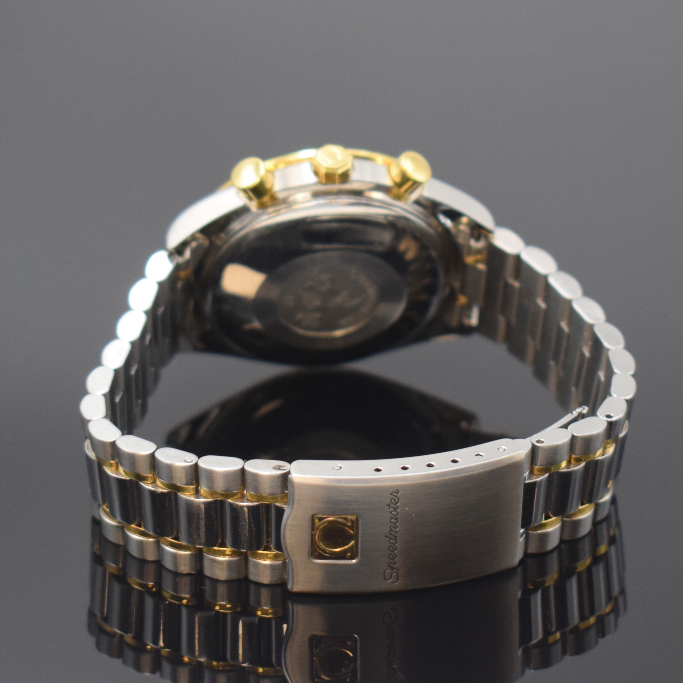 Detail b: OMEGA Speedmaster Herrenarmbanduhr mit Chronograph Referenz 175.0043/375.0043, Schweiz um 1995, Edelstahl/Gold komb., inkl. Gliederband m. Faltschl., ...