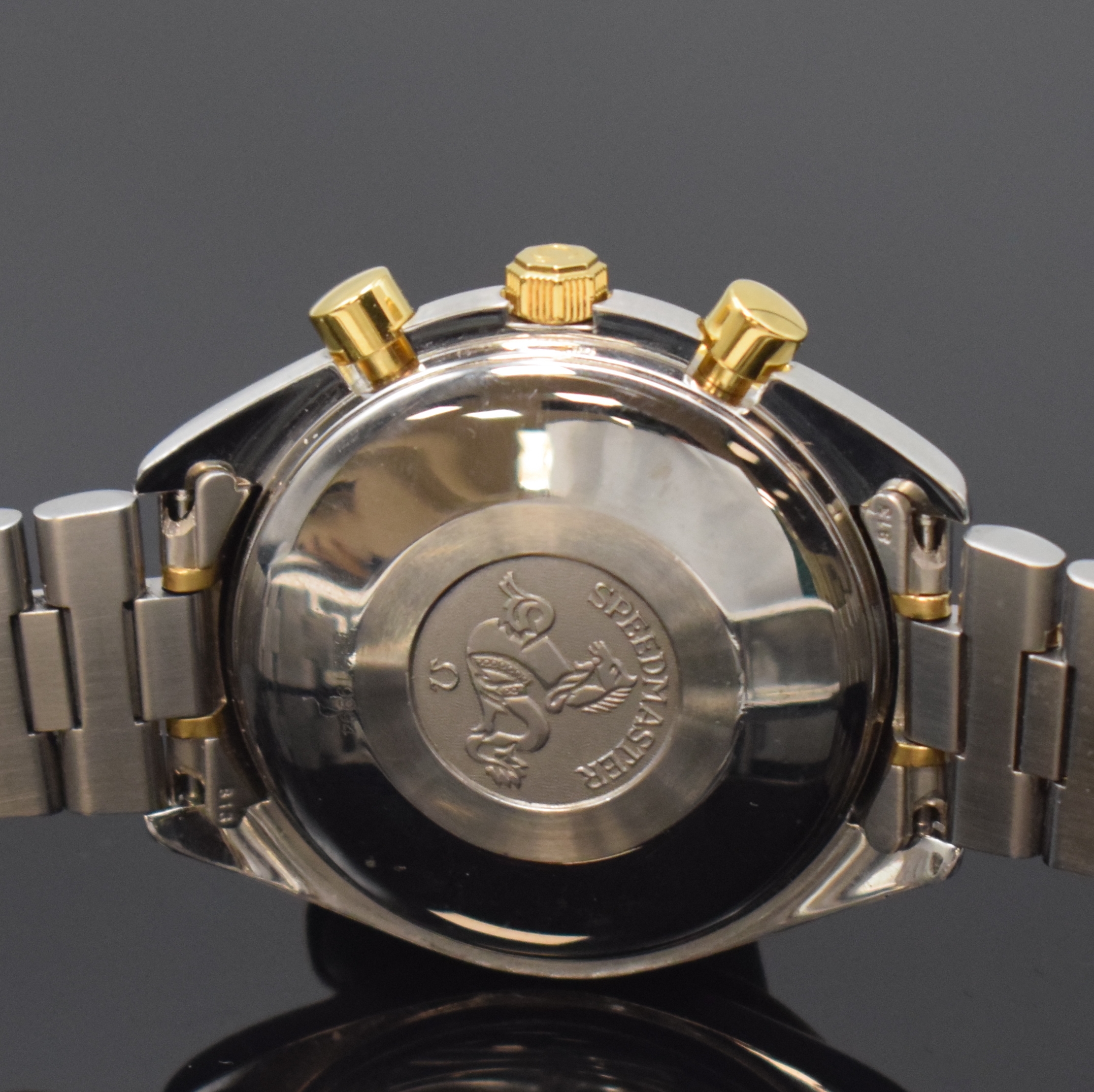 Detail d: OMEGA Speedmaster Herrenarmbanduhr mit Chronograph Referenz 175.0043/375.0043, Schweiz um 1995, Edelstahl/Gold komb., inkl. Gliederband m. Faltschl., ...