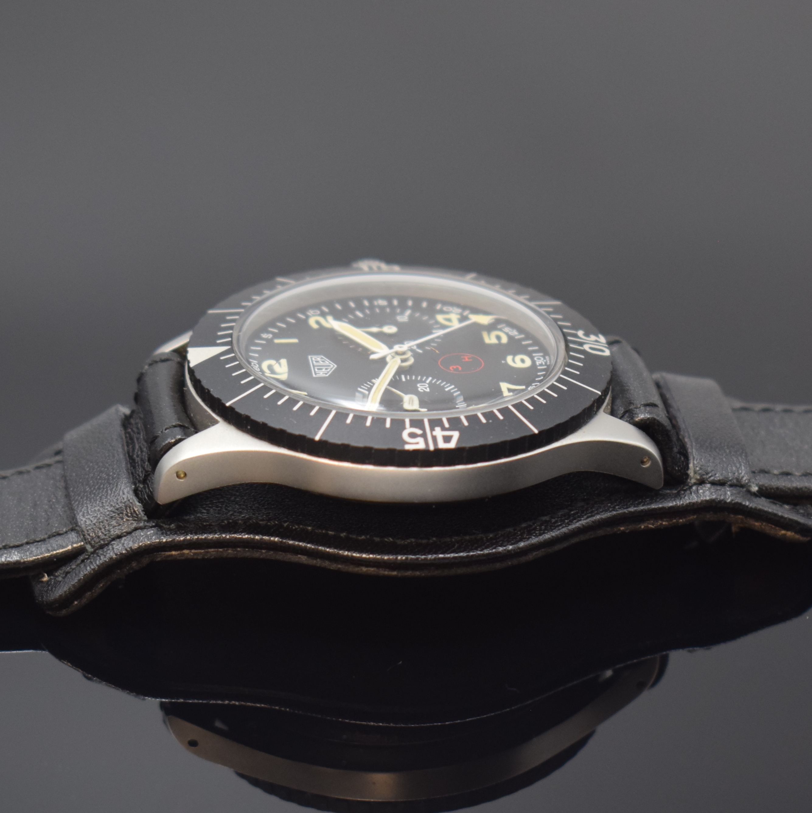 Detail c: HEUER 3H Flieger-Schaltradchronograph, Schweiz um 1970, Handaufzug, mattiertes Geh. 4-fach verschr., Boden m. Versorgungsnummer 6645-12-146-3774, ...