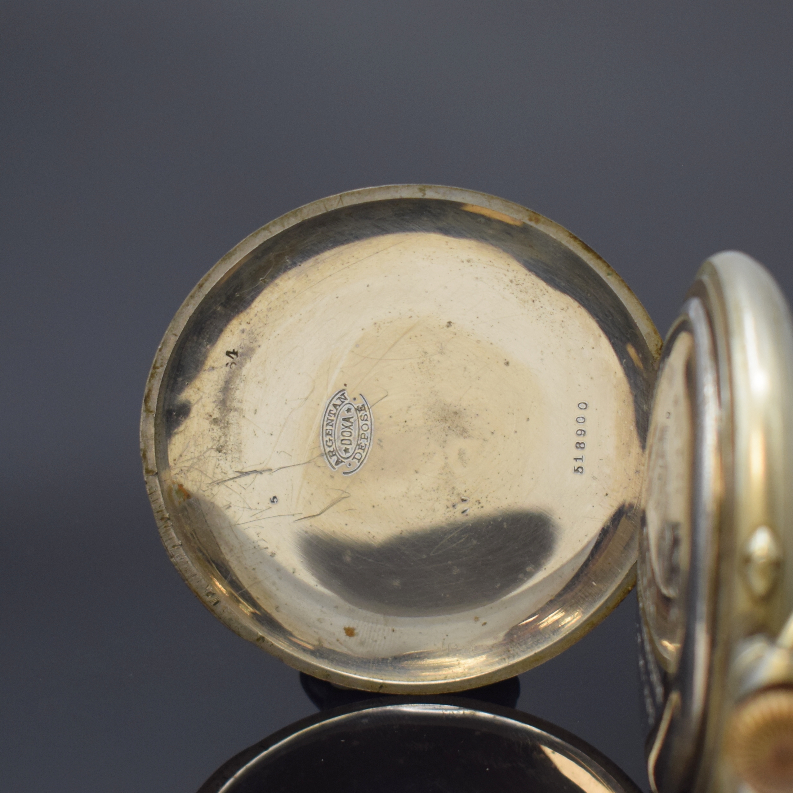 Detail b: DOXA große offene Taschenuhr im Argentan- Gehäuse, Schweiz um 1905, Geh. dell., Cuvette m. Medaillengravur, Emailzifferbl. m. röm. Zahlen l. ...