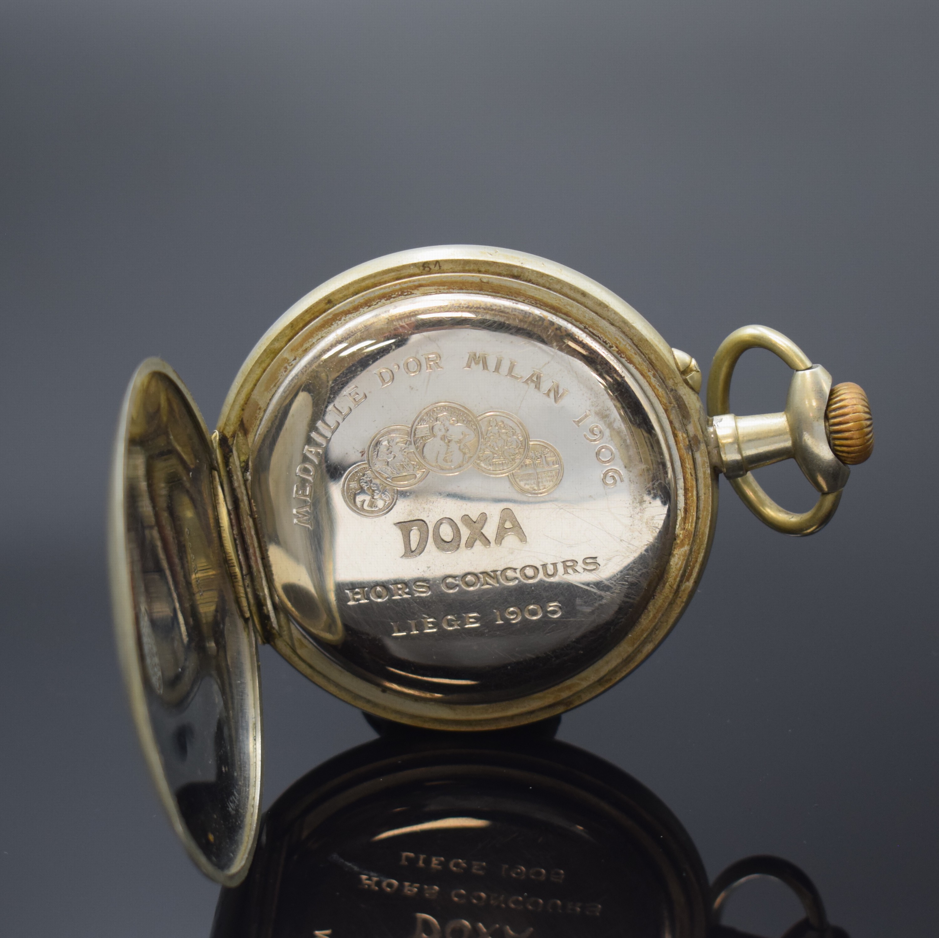 Detail c: DOXA große offene Taschenuhr im Argentan- Gehäuse, Schweiz um 1905, Geh. dell., Cuvette m. Medaillengravur, Emailzifferbl. m. röm. Zahlen l. ...
