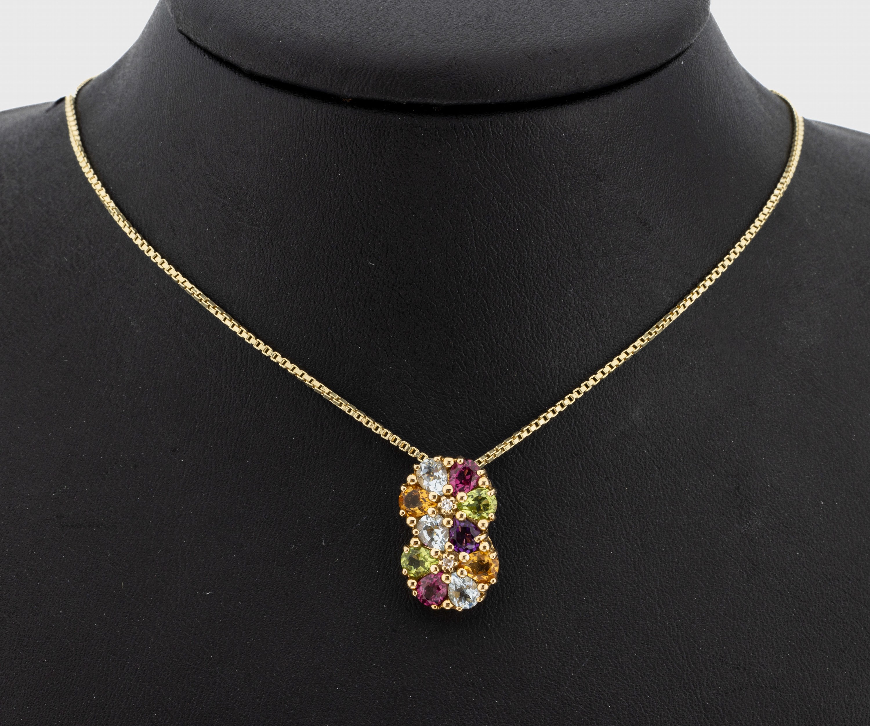 14 kt Gold Farbstein-Clipanhänger, GG 585/000, bes. mit facett. Citrin, Turmalin, Peridot und Aquamarin zus. ca. 2.00 ct, an Kette, L. ca. 64 cm, ...