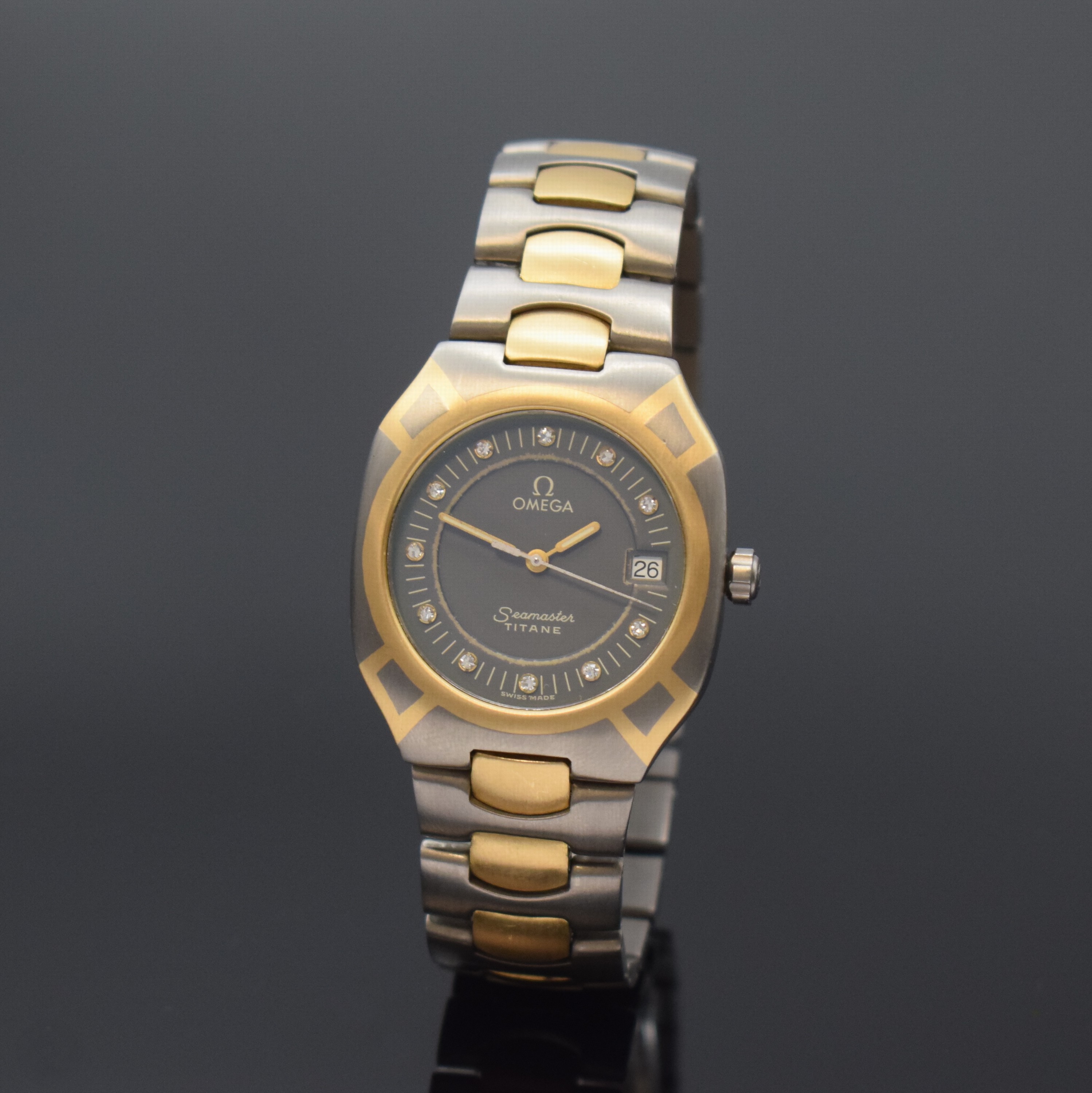 OMEGA Seamaster Polaris Armbanduhr Referenz 3961100, Schweiz um 1985, quarz, goldintarsiertes Titangeh. inkl. Gliederband in Titan/Gold m. Faltschl., ...
