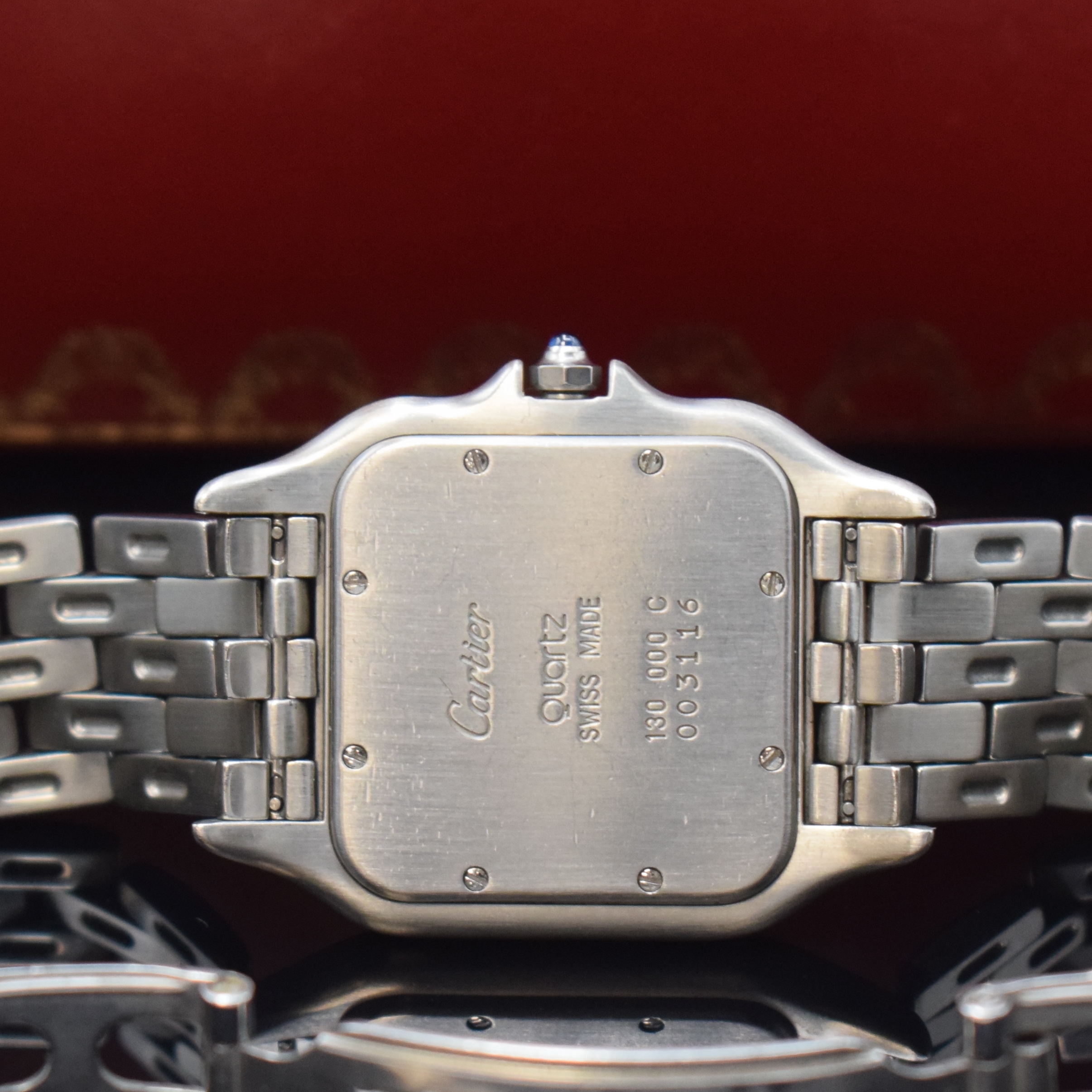 Detail d: CARTIER Panthere Armbanduhr in Edelstahl Referenz 130 000C, Schweiz um 1990, quarz, 2-teil. Gehäuse Boden 8-fach verschr., silb. Zifferbl. m. röm. ...