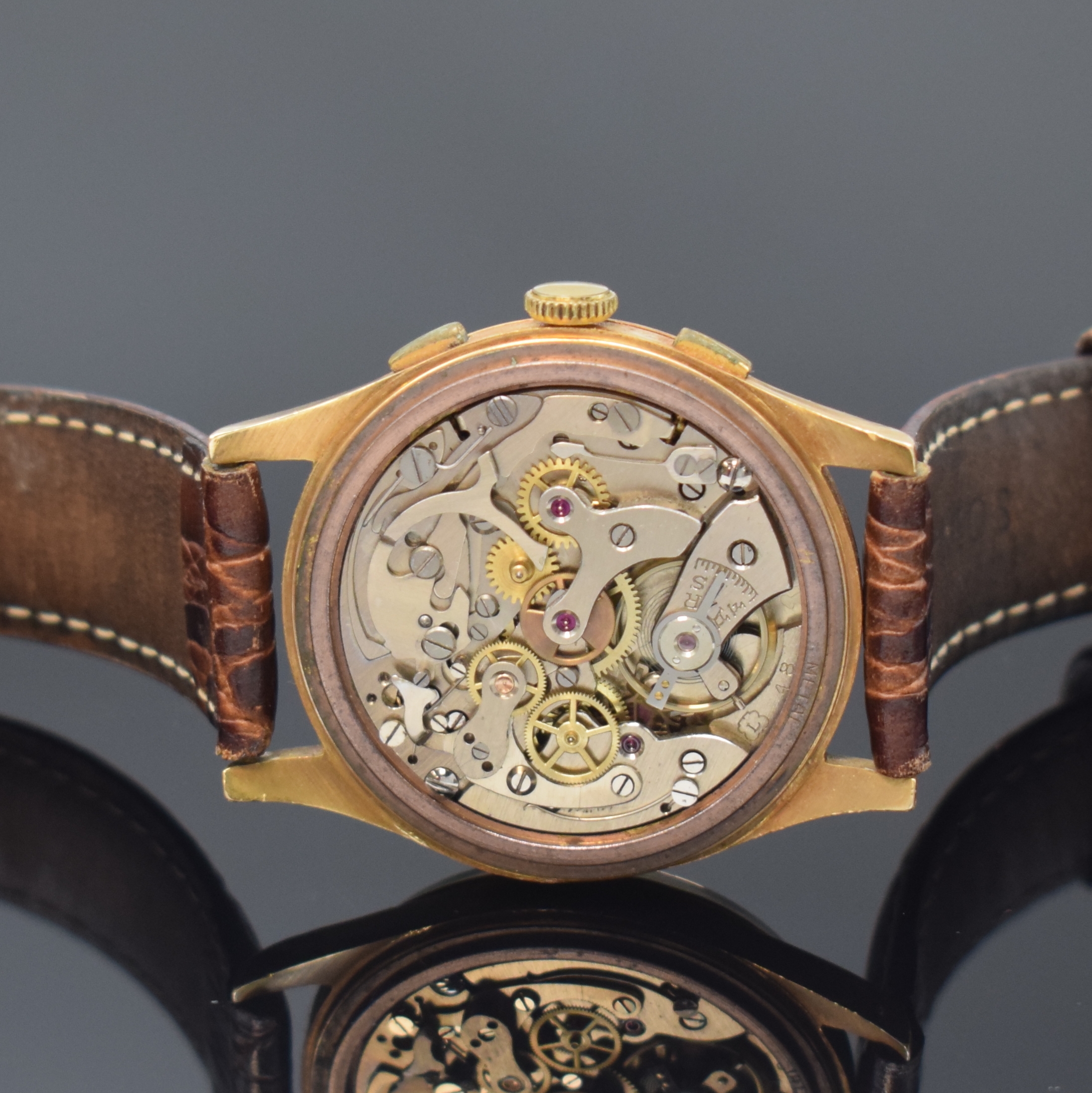 Detail e: CHRONOGRAPHE SUISSE Herrenarmbanduhr mit Chronograph in RG 750/000, Schweiz um 1950, Handaufzug, 3-teil. Geh. dell., Boden und Glasrand aufgedr., ...