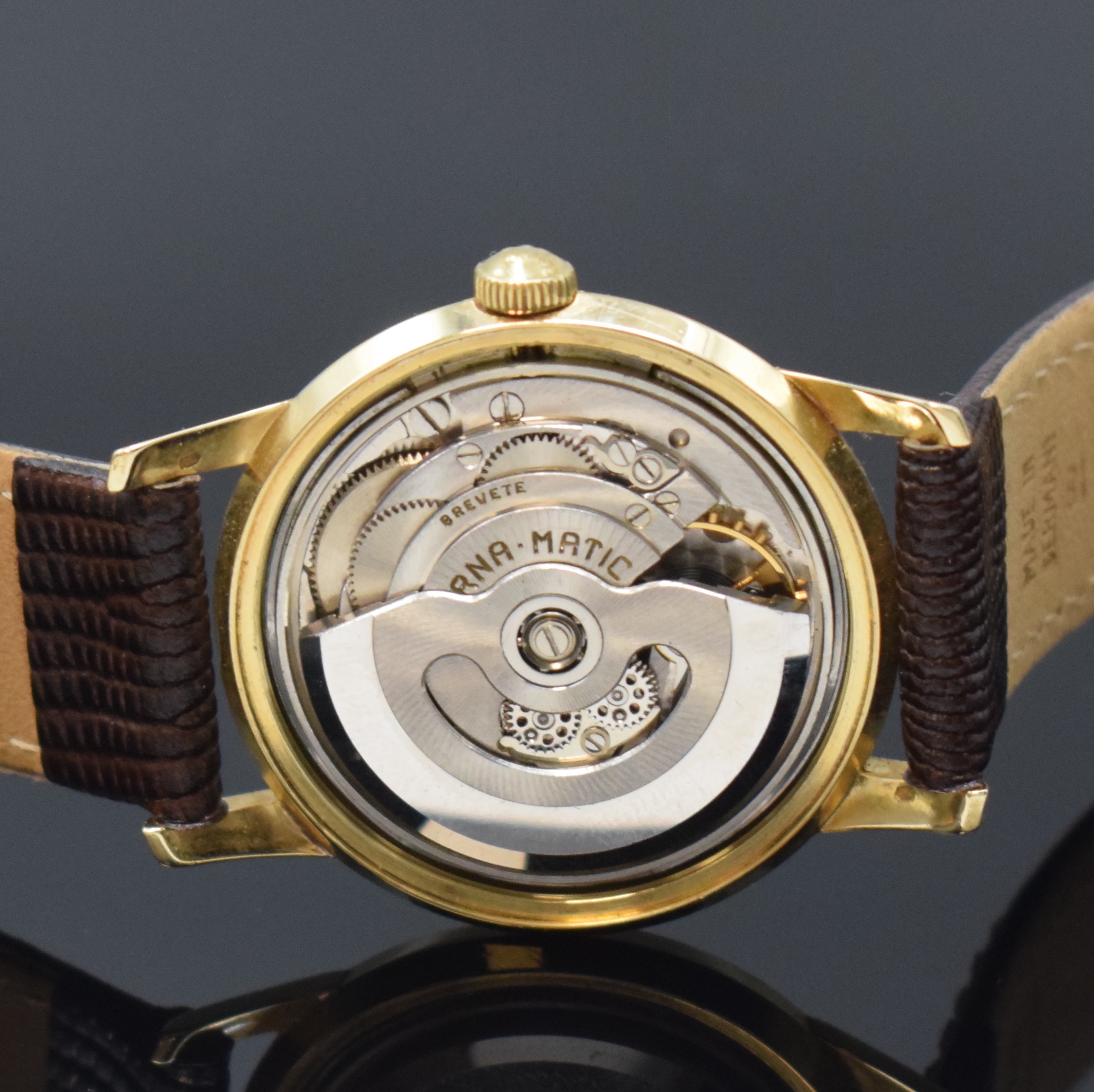 Detail d: ETERNA-MATIC Armbanduhr in GG 585/000, Schweiz um 1960, Boden verschr., Zifferbl. m. aufges. gold. Indizes altersbed. fl./pat., gold. Zeiger, rhod. ...