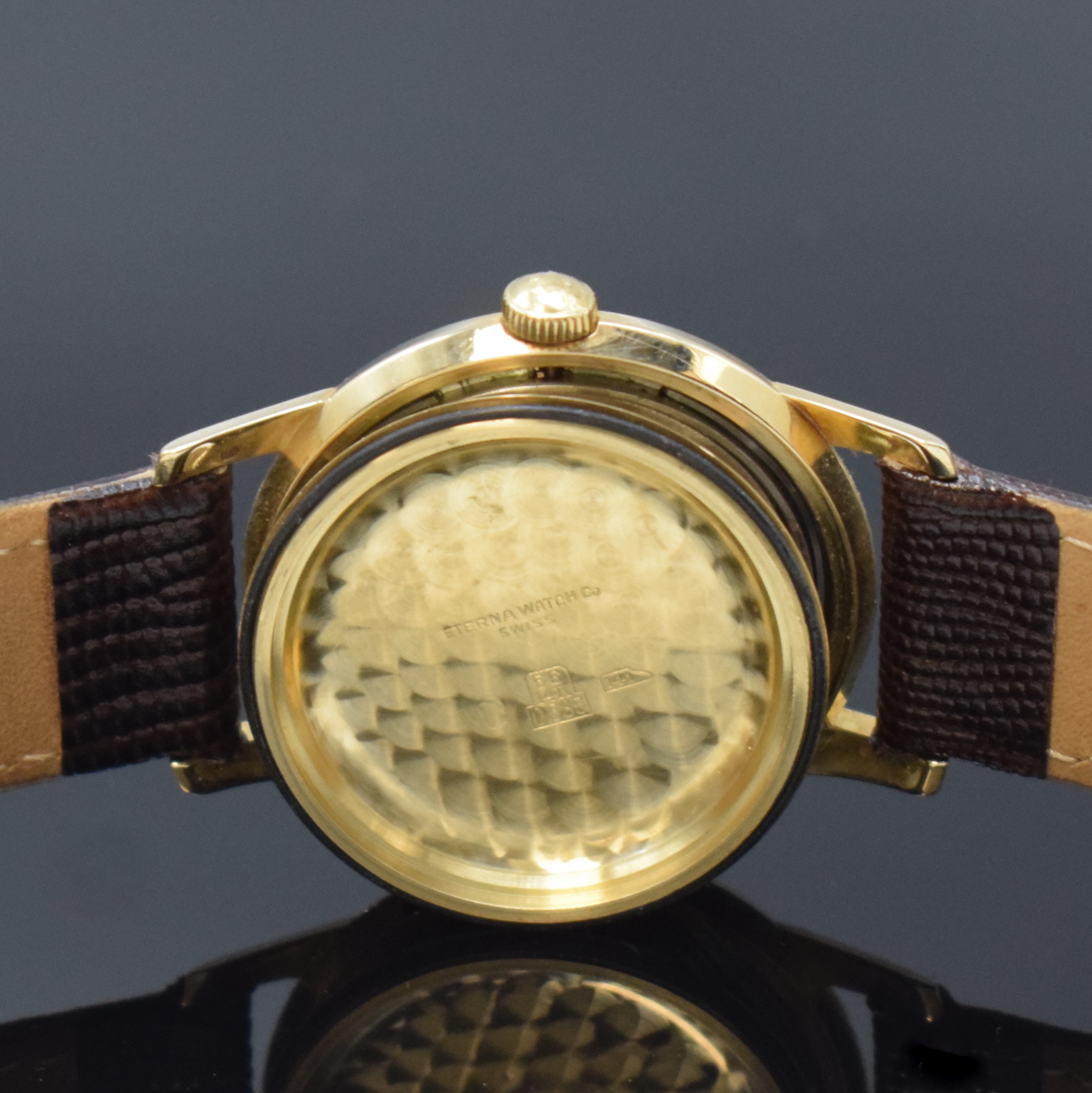 Detail f: ETERNA-MATIC Armbanduhr in GG 585/000, Schweiz um 1960, Boden verschr., Zifferbl. m. aufges. gold. Indizes altersbed. fl./pat., gold. Zeiger, rhod. ...