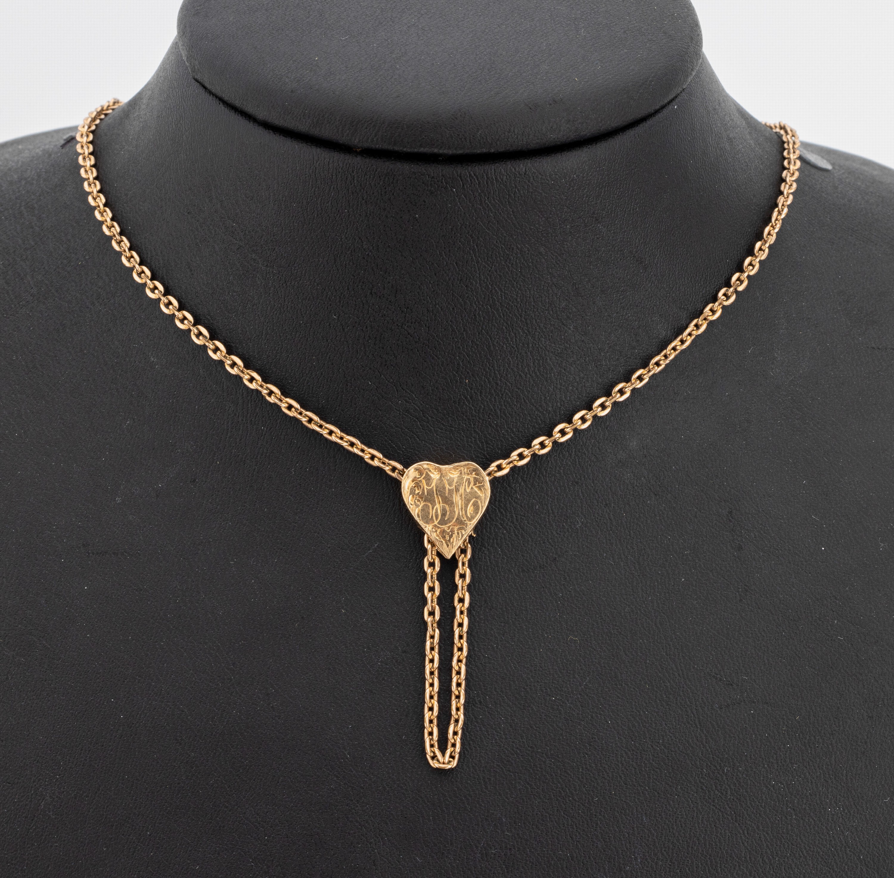 9 kt Gold Collier, wohl England um 1900, GG 375/000, Schieber in Herzform mit ligiertemMonogramm, L. ca. 64 cm, ca. 7.2 g, Herz verbeult