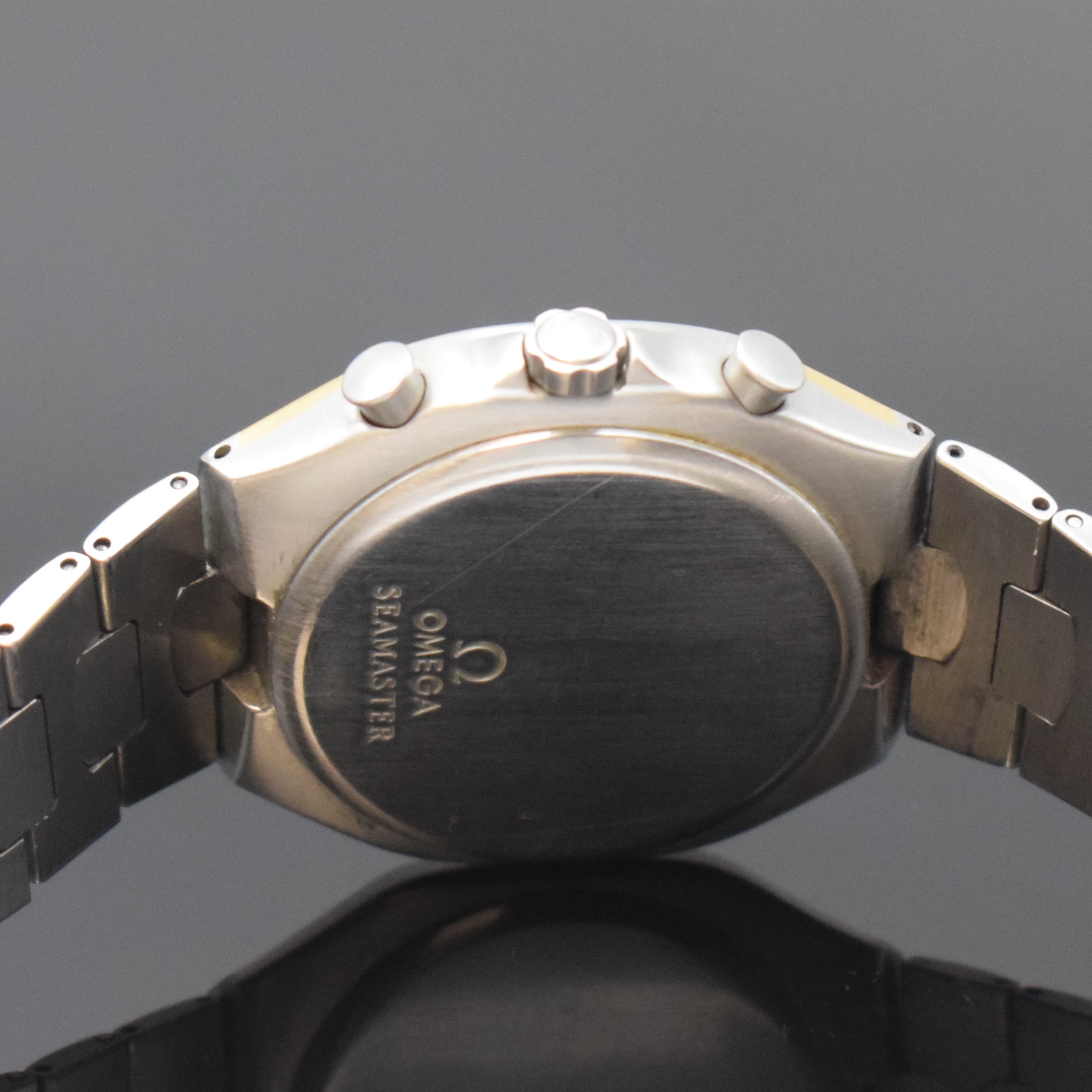 Detail d: OMEGA Seamaster Polaris Armbandchronograph Referenz 386.1031, Schweiz um 1990, quarz, goldintarsiertes Edelstahlgeh. inkl. Edelstahlgliederband m. ...
