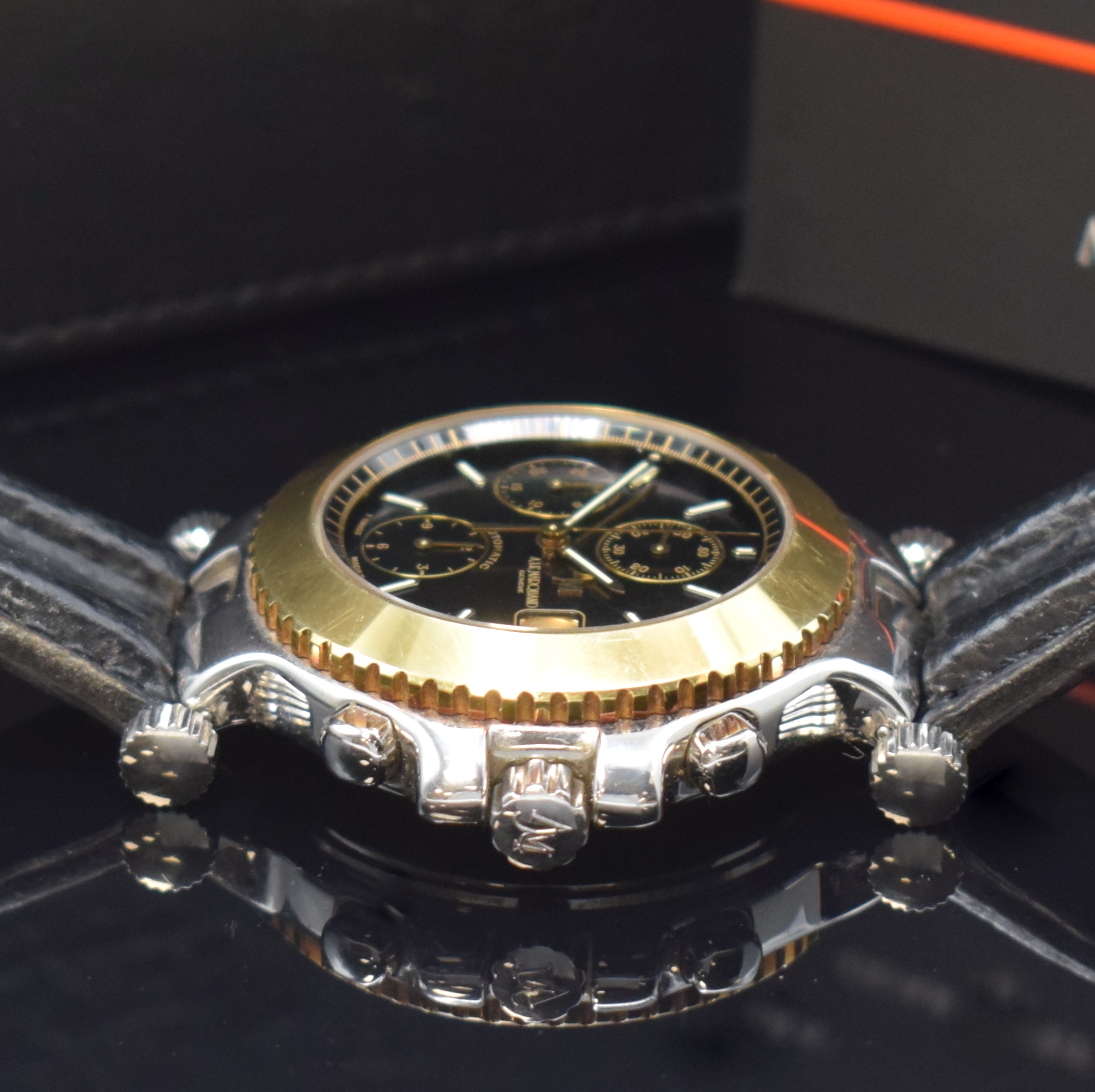 Detail c: ANDRE LE MARQUAND Herrenchronograph in Stahl/Gold, Schweiz um 1994, Automatik, beids. vergl. Geh., Boden u. Krone verschr., Lünette in 18k Gold, ...
