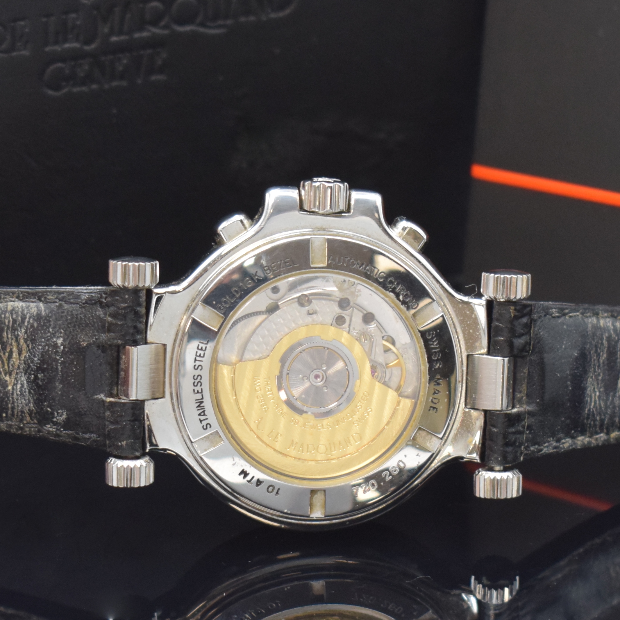 Detail d: ANDRE LE MARQUAND Herrenchronograph in Stahl/Gold, Schweiz um 1994, Automatik, beids. vergl. Geh., Boden u. Krone verschr., Lünette in 18k Gold, ...