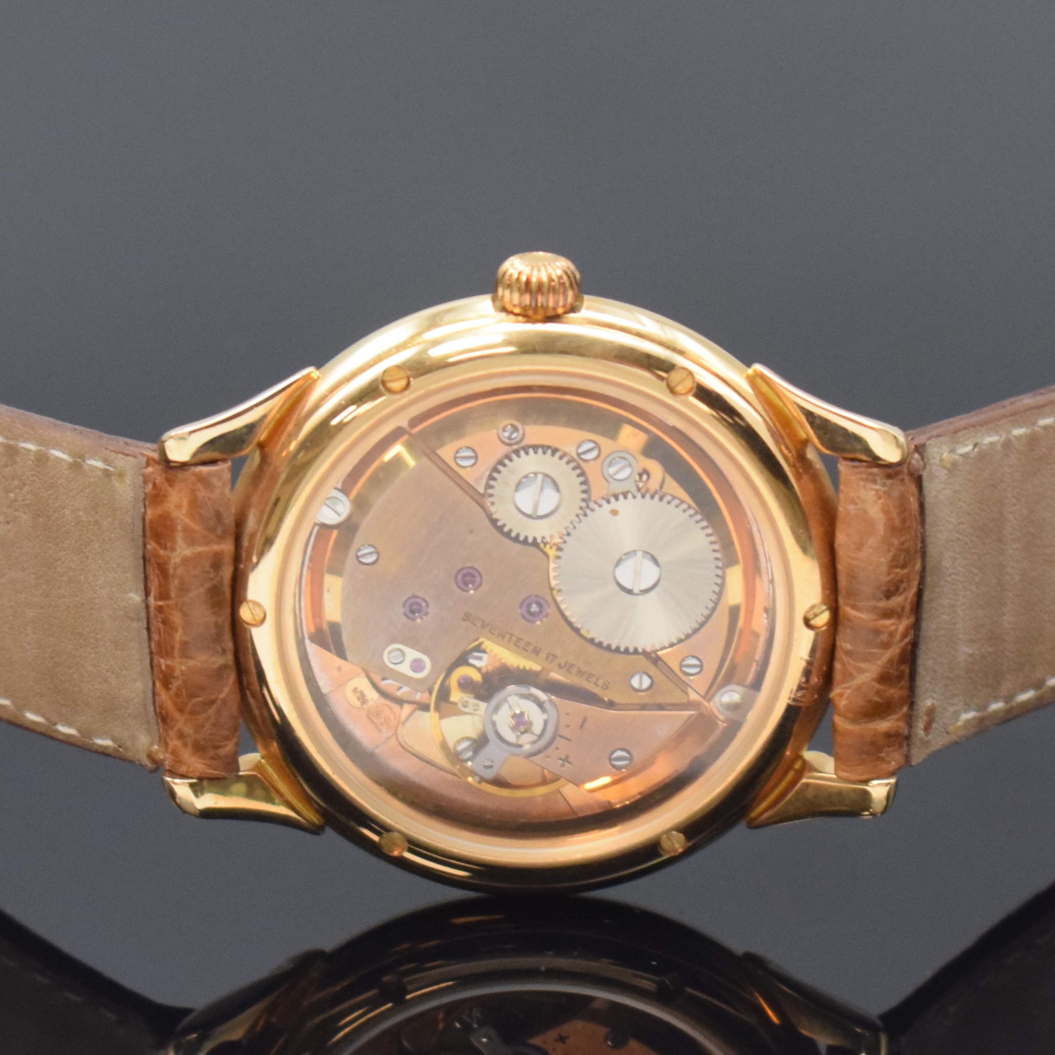 Detail d: JEAN MARCEL Armbanduhr in RoseG 750/000, Schweiz um 1990, Handaufzug, beids. vergl. Geh., neutr. Lederband m. orig. verg. Dornschl., cremefarb. ...