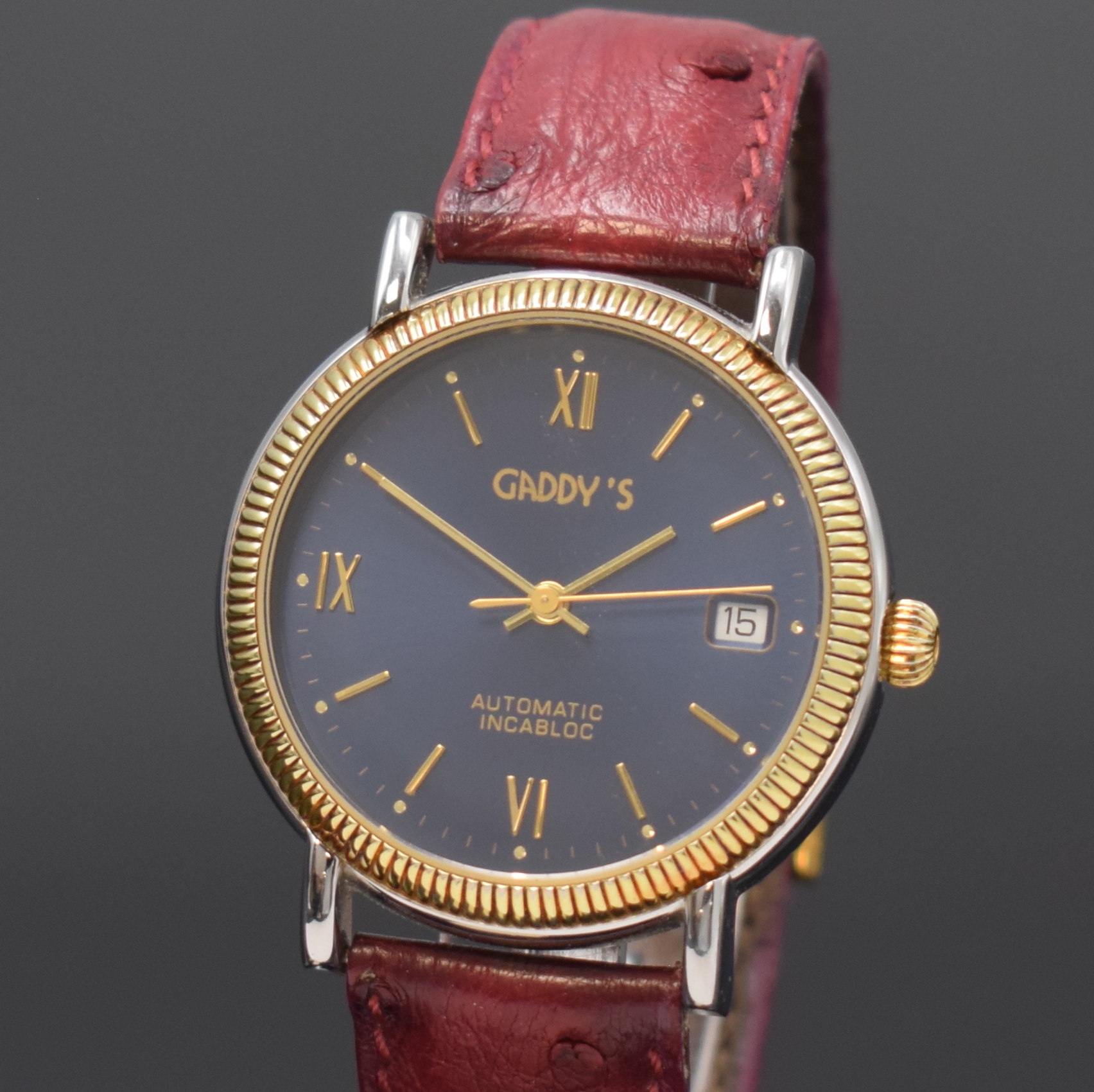 Detail a: GADDY'S Herrenarmbanduhr in Stahl, Schweiz um 2000, Automatik, beids. vergl. Geh., Boden verschr., blaues Zifferbl. m. gold. Std.-Ind. u. röm. ...