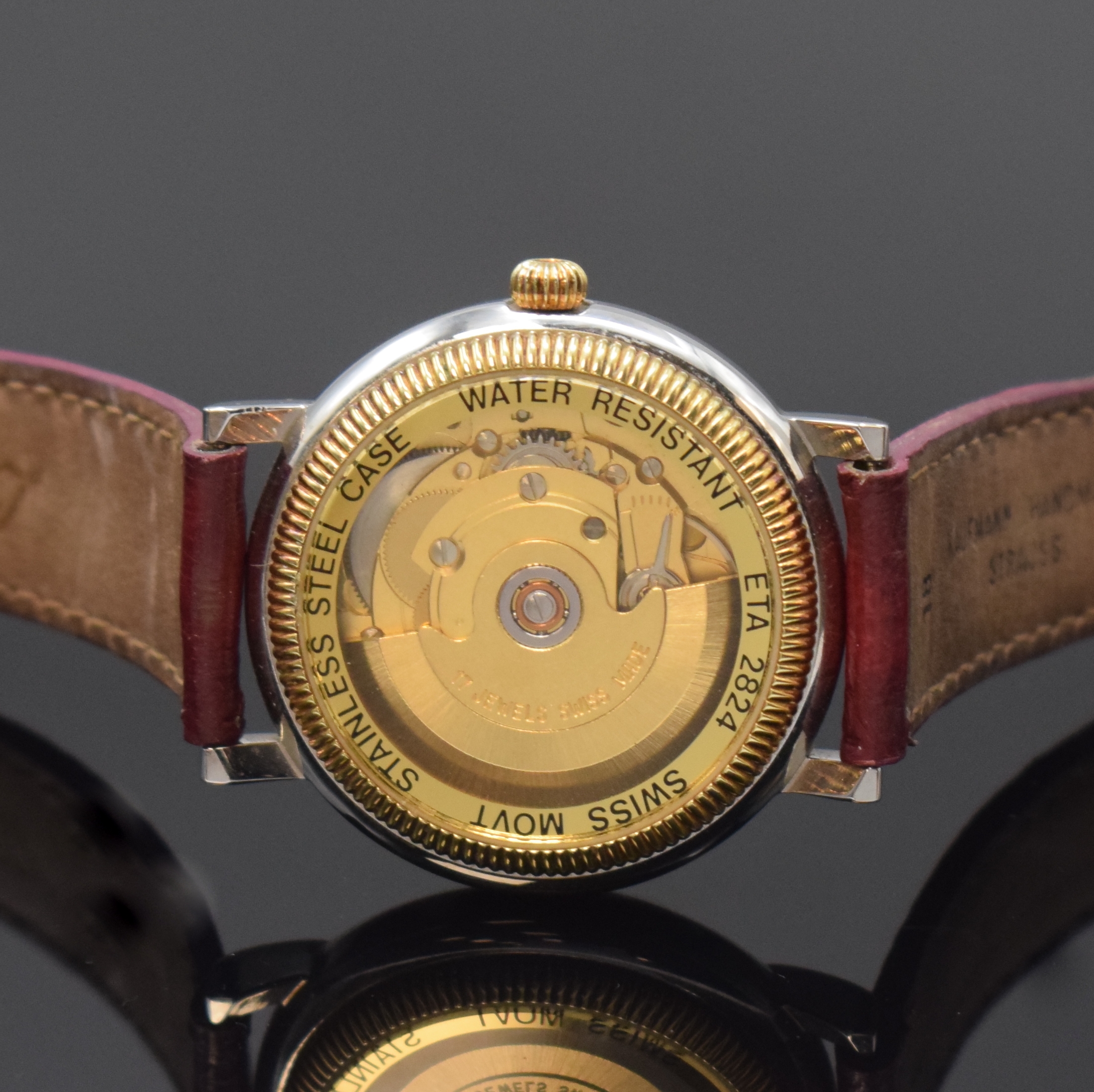 Detail c: GADDY'S Herrenarmbanduhr in Stahl, Schweiz um 2000, Automatik, beids. vergl. Geh., Boden verschr., blaues Zifferbl. m. gold. Std.-Ind. u. röm. ...
