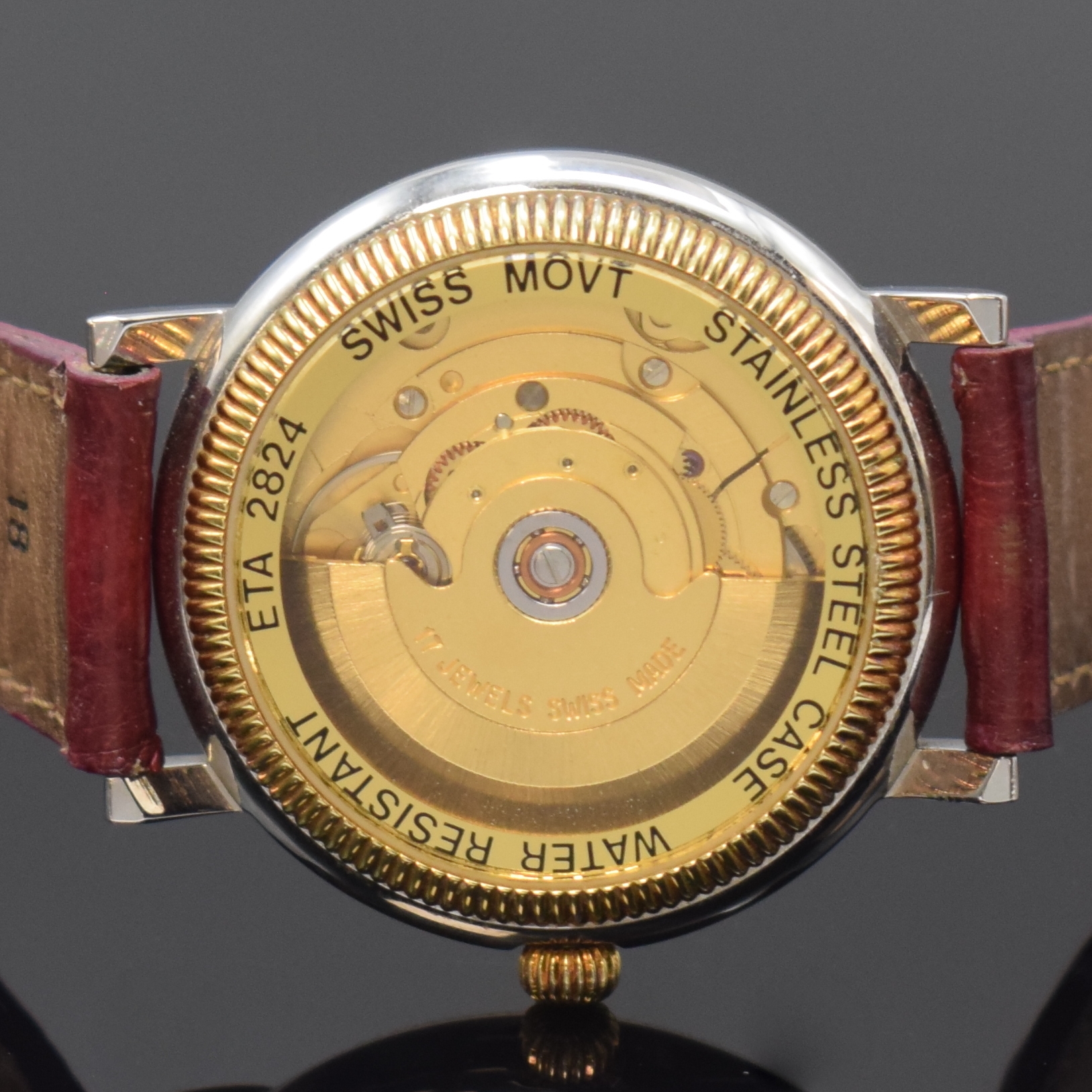 Detail d: GADDY'S Herrenarmbanduhr in Stahl, Schweiz um 2000, Automatik, beids. vergl. Geh., Boden verschr., blaues Zifferbl. m. gold. Std.-Ind. u. röm. ...