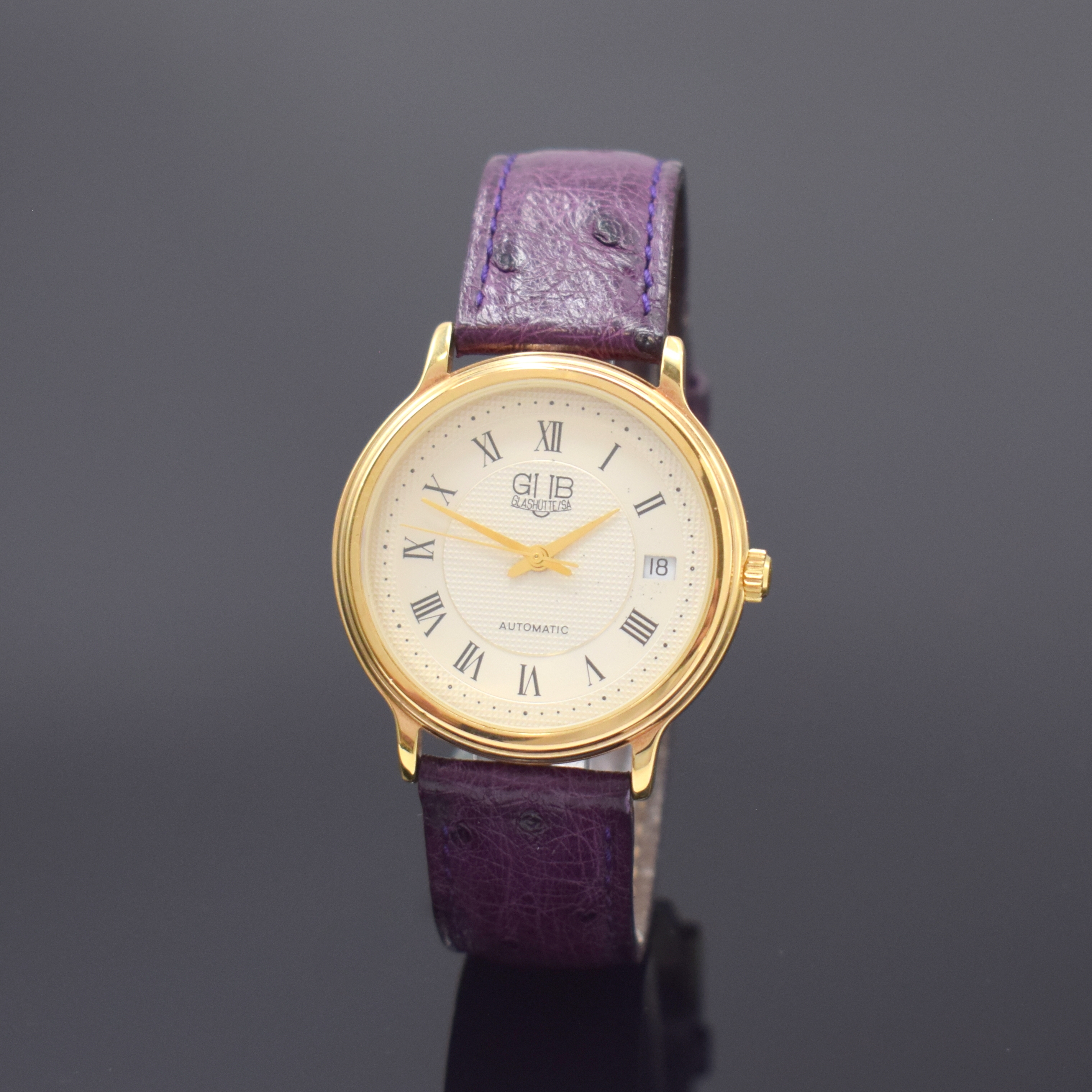 GUB Glashütte SA Herrenarmbanduhr, Deutschland um 1990, Automatik, verg. Geh., Stahlboden aufgedr., silb. Zifferbl. teils guill., röm. Zahlen, ...