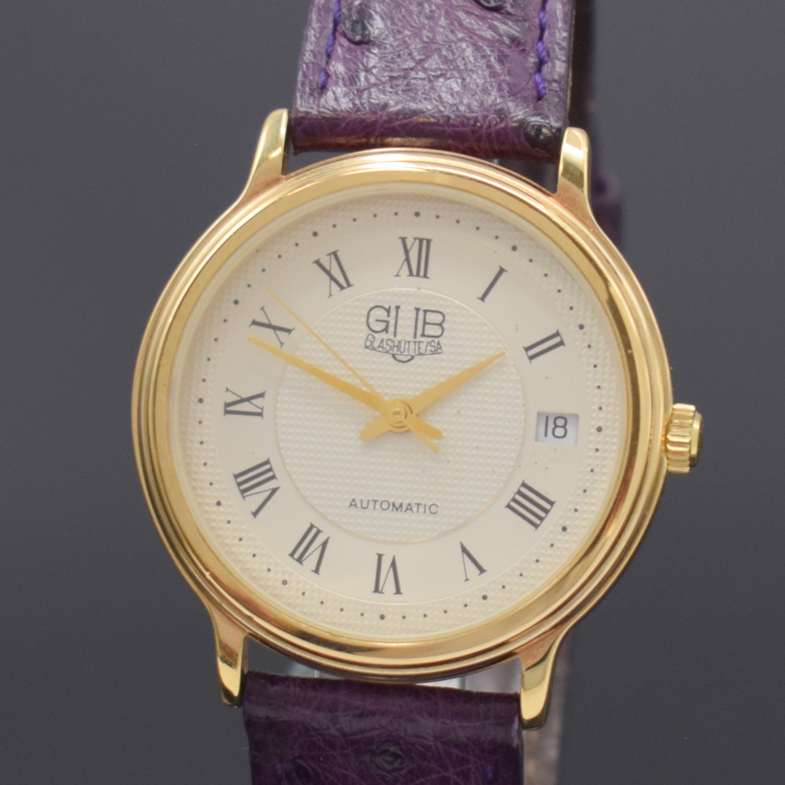 Detail a: GUB Glashütte SA Herrenarmbanduhr, Deutschland um 1990, Automatik, verg. Geh., Stahlboden aufgedr., silb. Zifferbl. teils guill., röm. Zahlen, ...