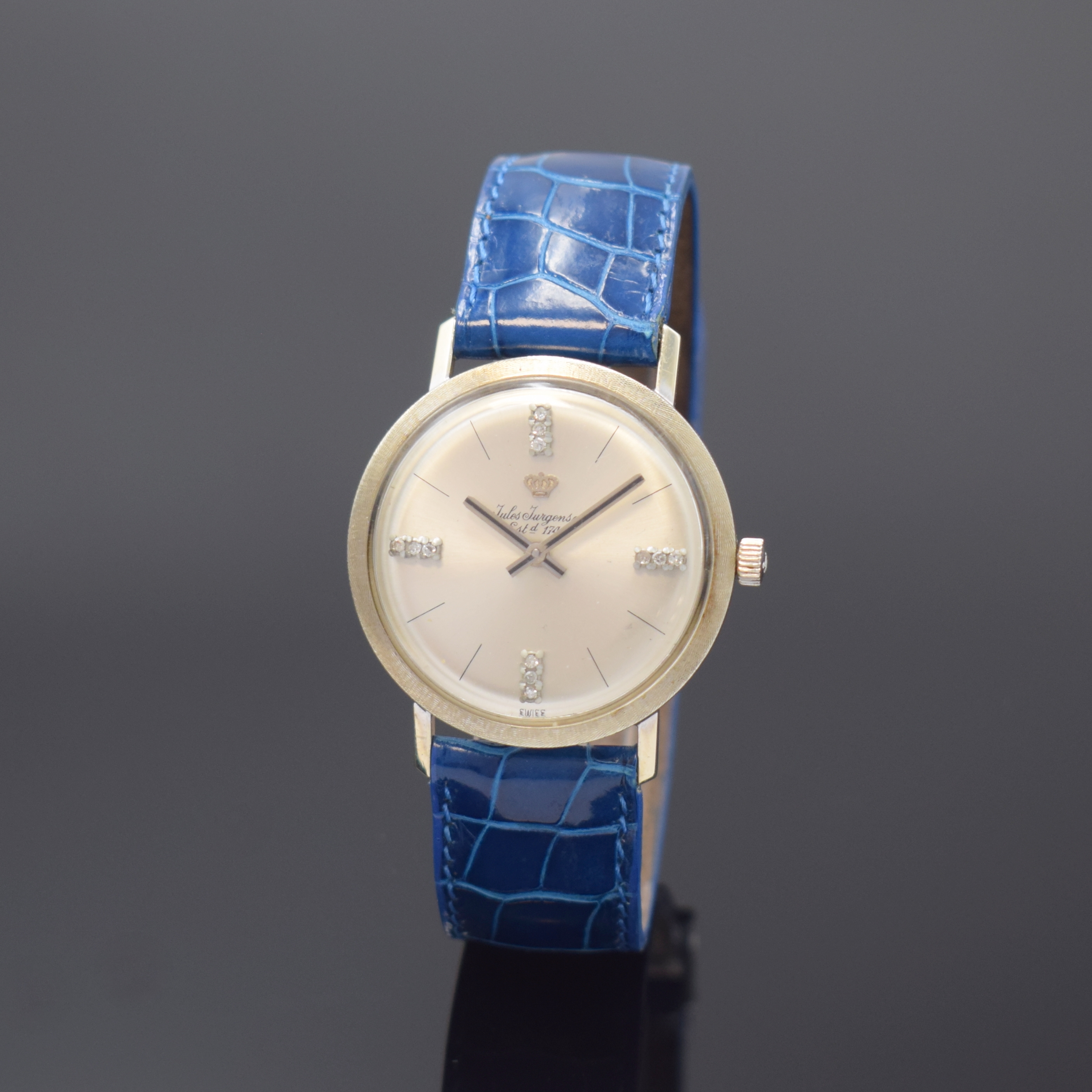 JULES JÜRGENSEN Armbanduhr in WG 585/000, Schweiz/USA um 1965, Handaufzug, Einschalengeh., silb. Zifferbl. m. Diamant u. Strich-Ind., silb. Zeiger, ...