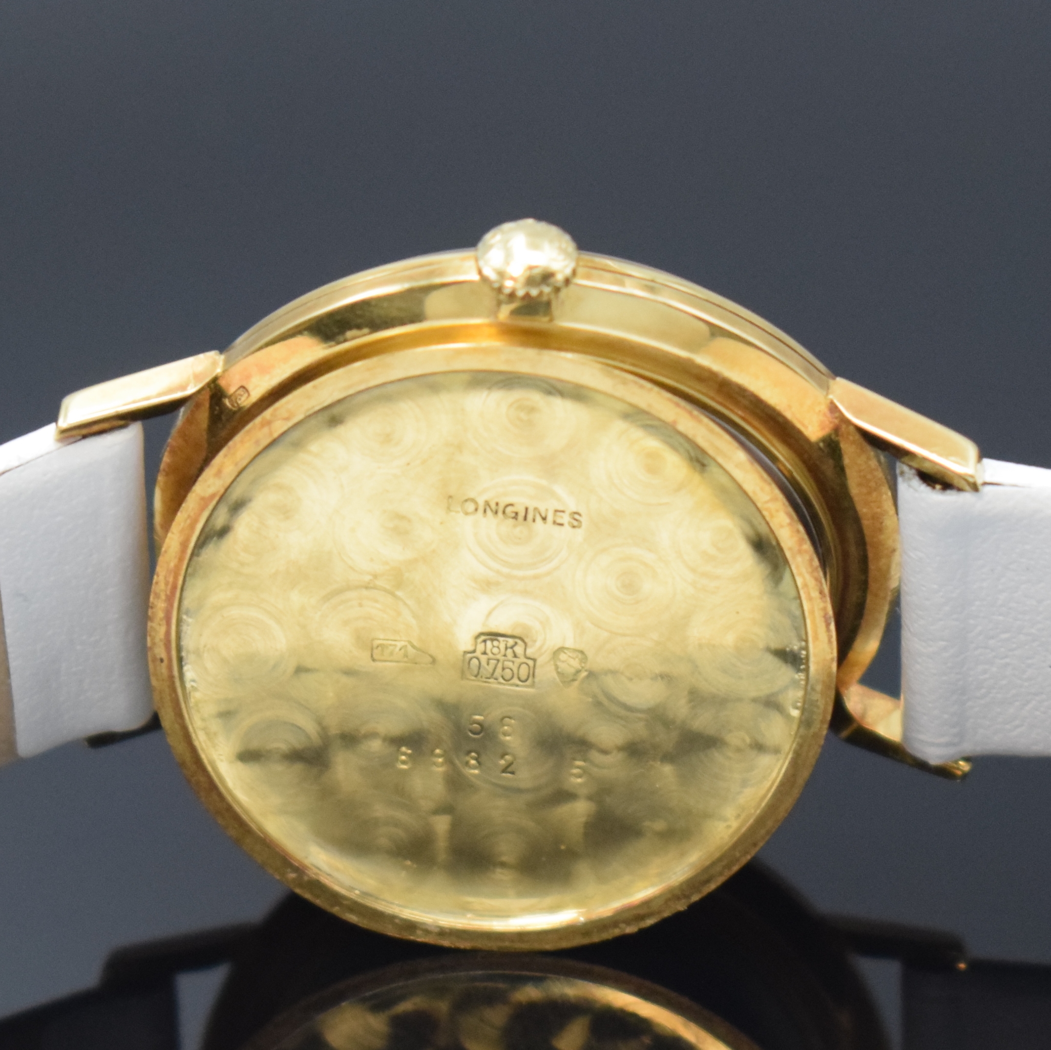 Detail e: LONGINES Armbanduhr in GG 750/000, Schweiz um 1960, Handaufzug, Boden gedr., blaues Zifferbl. m. gold. Std.-Ind., gold. Zeiger, kl. Sek. b. 6, Kal. ...