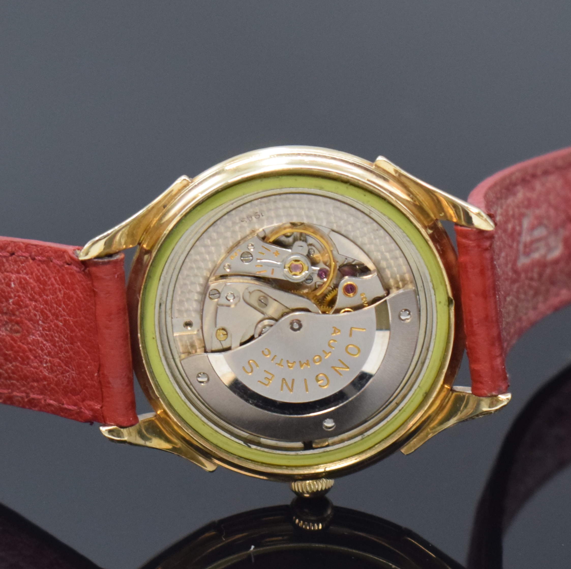 Detail e: LONGINES 10k Gold Filled Herrenarmbanduhr, Schweiz um 1955, Automatik, Boden verschr., silb. Zifferbl. m. Strahlendekor, gold. Std.- Ind., gold. ...