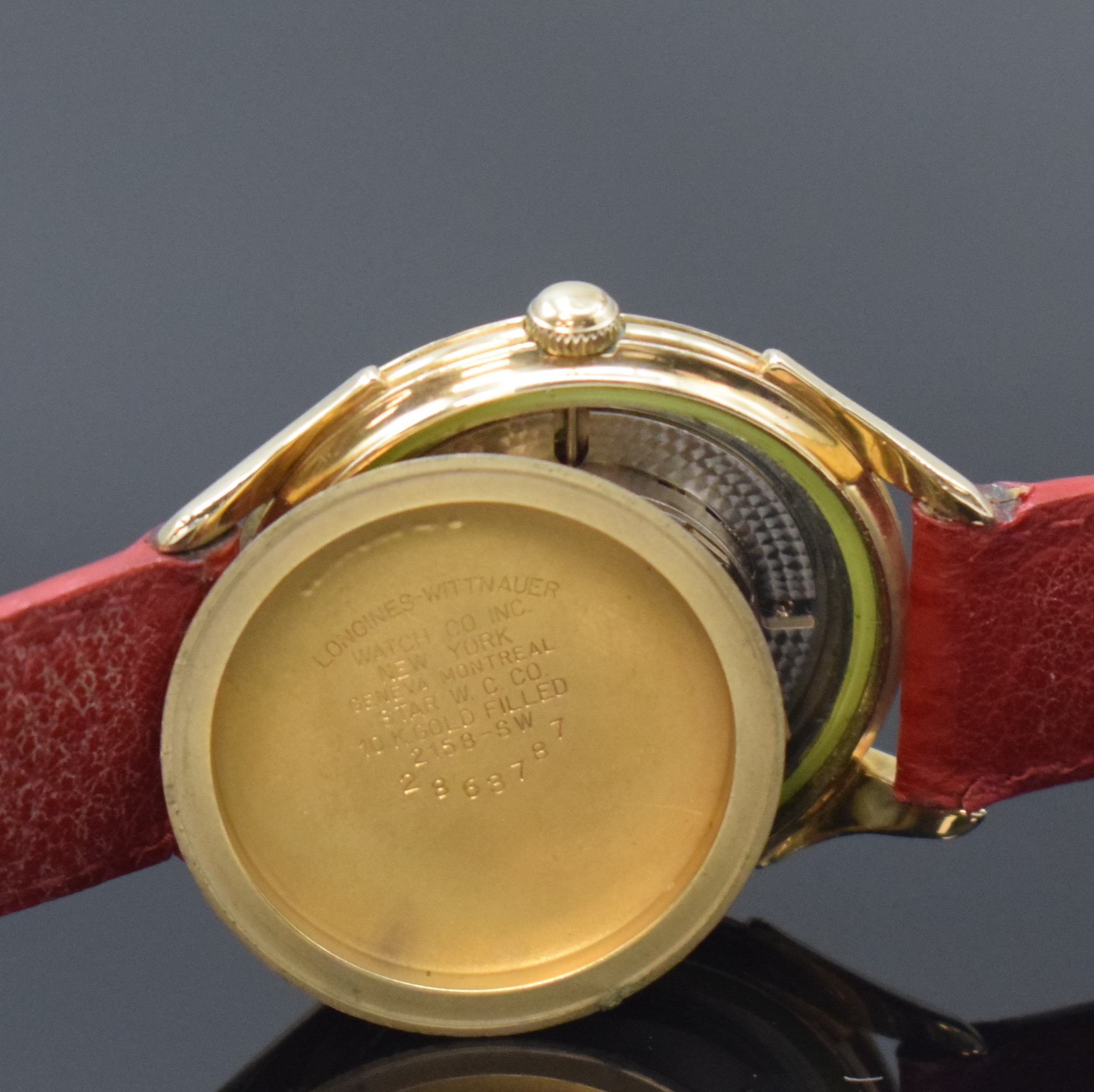 Detail f: LONGINES 10k Gold Filled Herrenarmbanduhr, Schweiz um 1955, Automatik, Boden verschr., silb. Zifferbl. m. Strahlendekor, gold. Std.- Ind., gold. ...