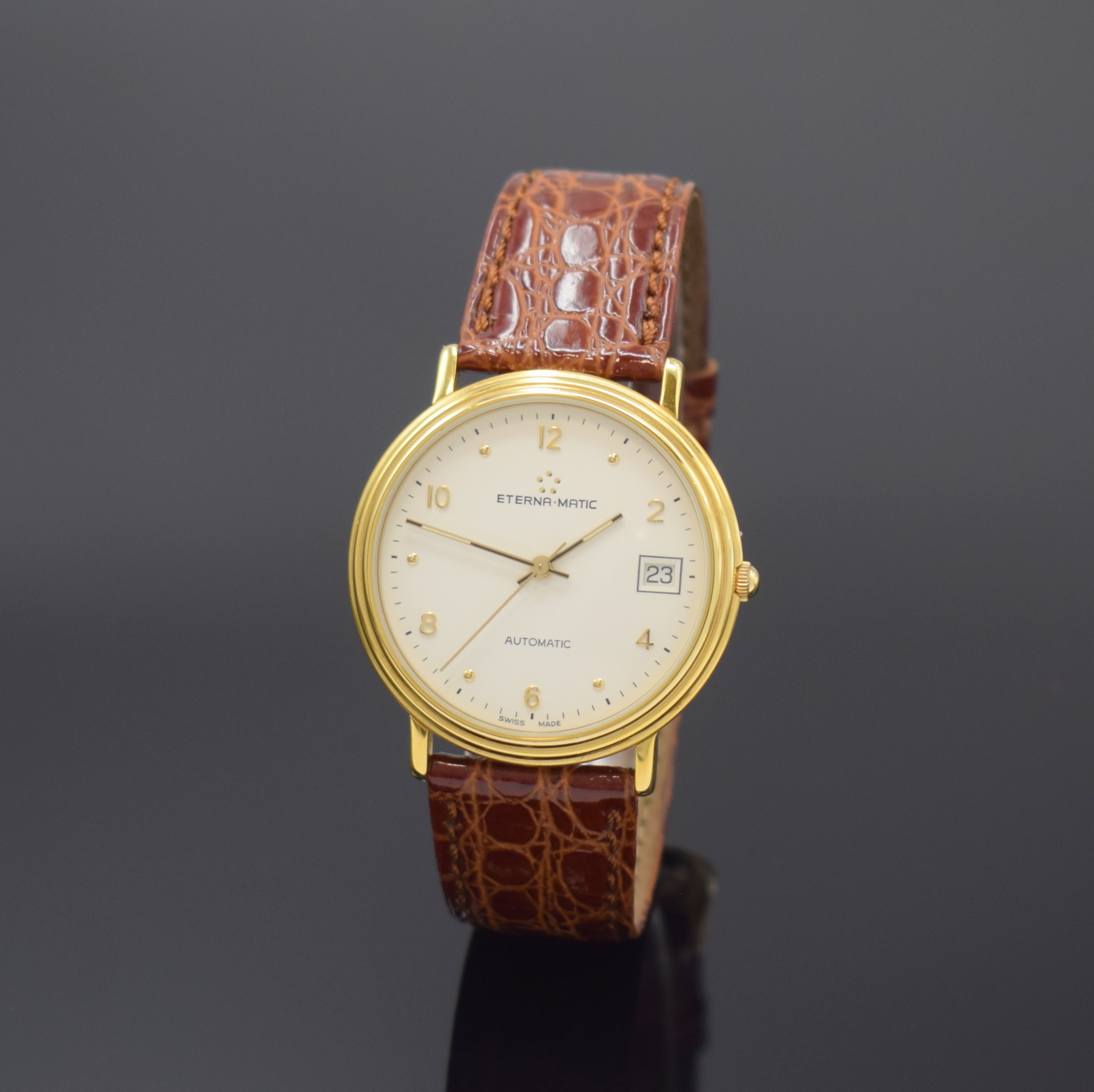 ETERNA-MATIC vergoldete Armbanduhr, Schweiz um 1990, Automatik, beids. vergl. Geh., Boden aufgedr., weißes Zifferbl. m. gold. Std.-Ind. u. arab. ...