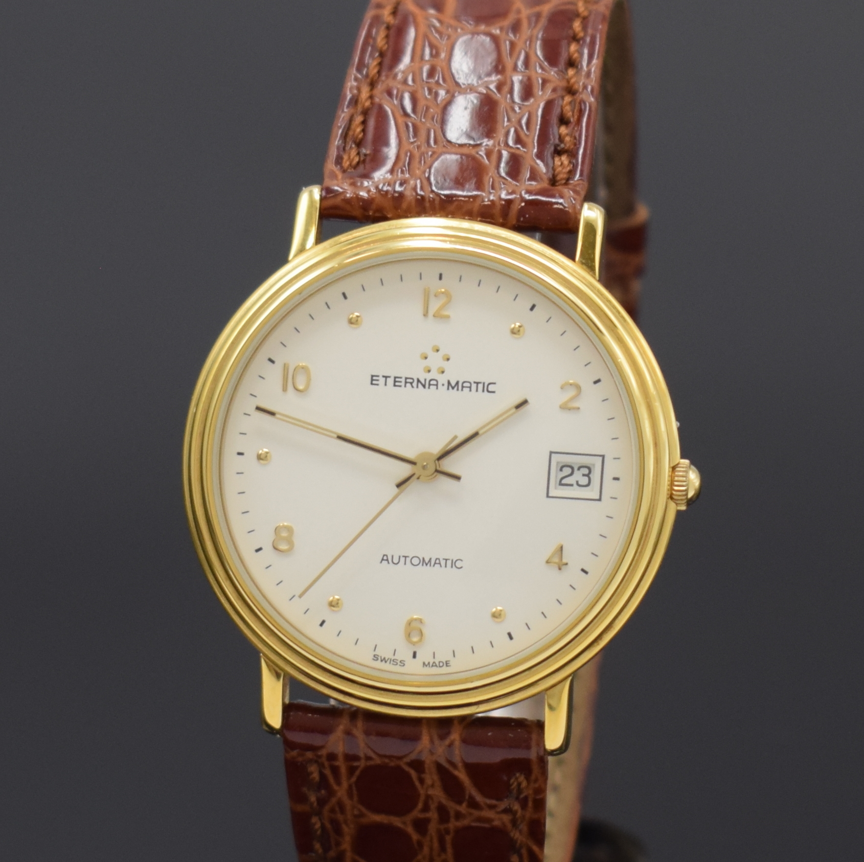 Detail a: ETERNA-MATIC vergoldete Armbanduhr, Schweiz um 1990, Automatik, beids. vergl. Geh., Boden aufgedr., weißes Zifferbl. m. gold. Std.-Ind. u. arab. ...