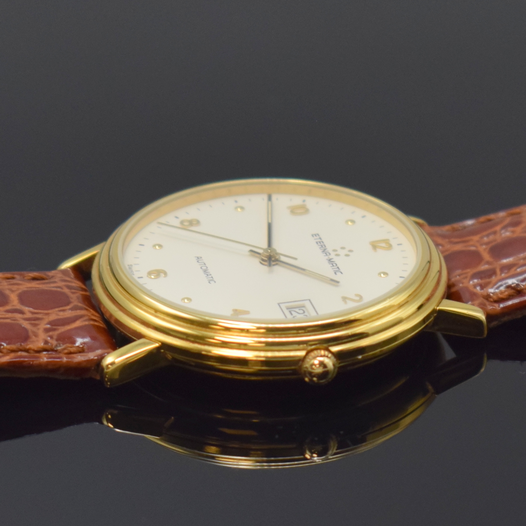 Detail b: ETERNA-MATIC vergoldete Armbanduhr, Schweiz um 1990, Automatik, beids. vergl. Geh., Boden aufgedr., weißes Zifferbl. m. gold. Std.-Ind. u. arab. ...