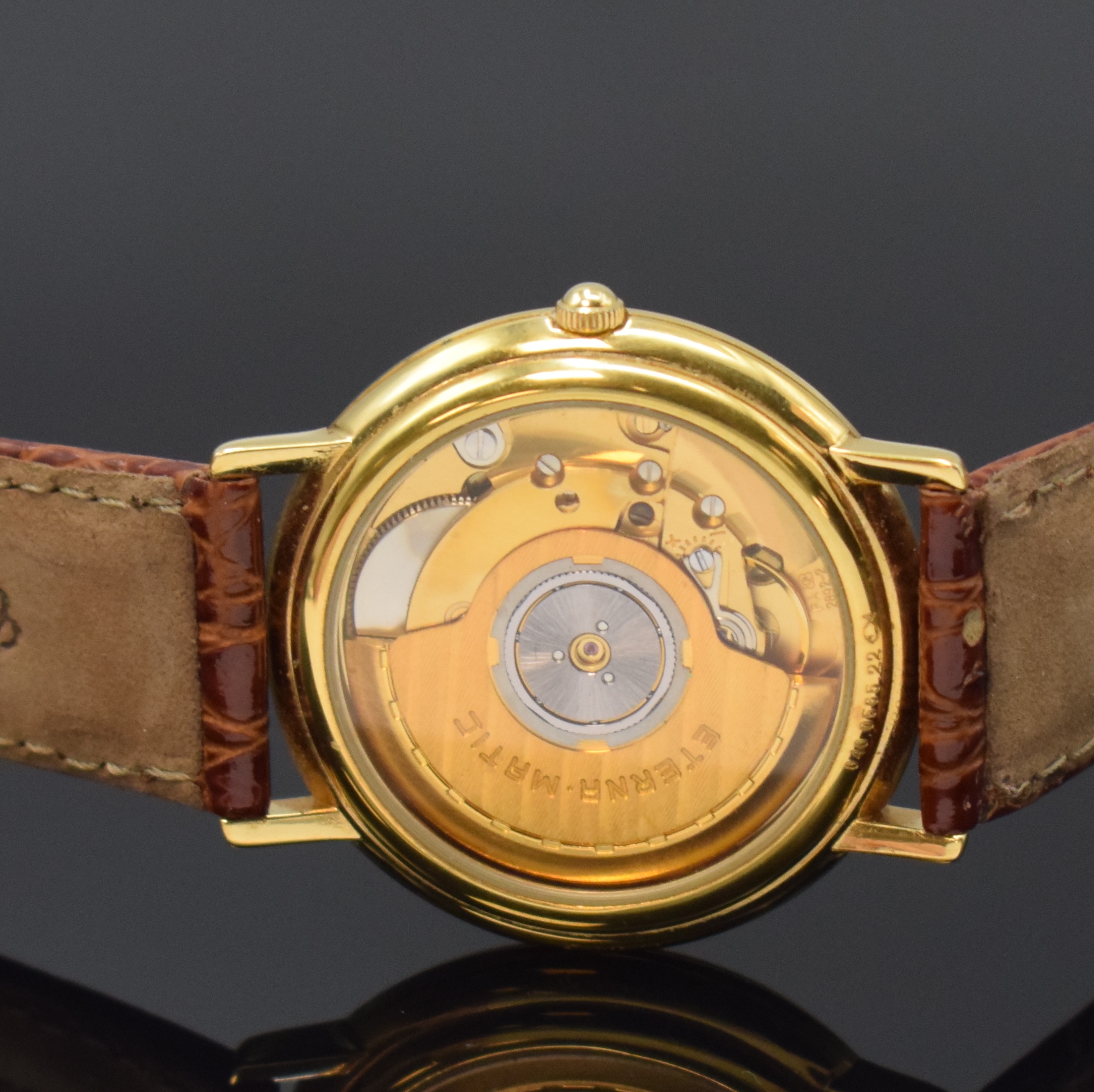 Detail c: ETERNA-MATIC vergoldete Armbanduhr, Schweiz um 1990, Automatik, beids. vergl. Geh., Boden aufgedr., weißes Zifferbl. m. gold. Std.-Ind. u. arab. ...