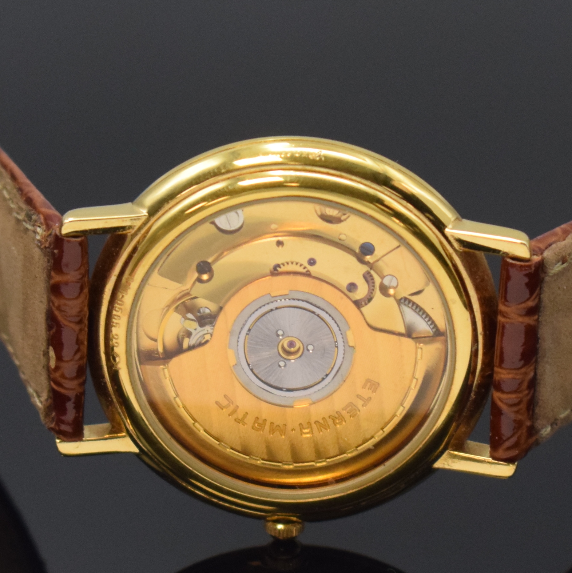 Detail d: ETERNA-MATIC vergoldete Armbanduhr, Schweiz um 1990, Automatik, beids. vergl. Geh., Boden aufgedr., weißes Zifferbl. m. gold. Std.-Ind. u. arab. ...