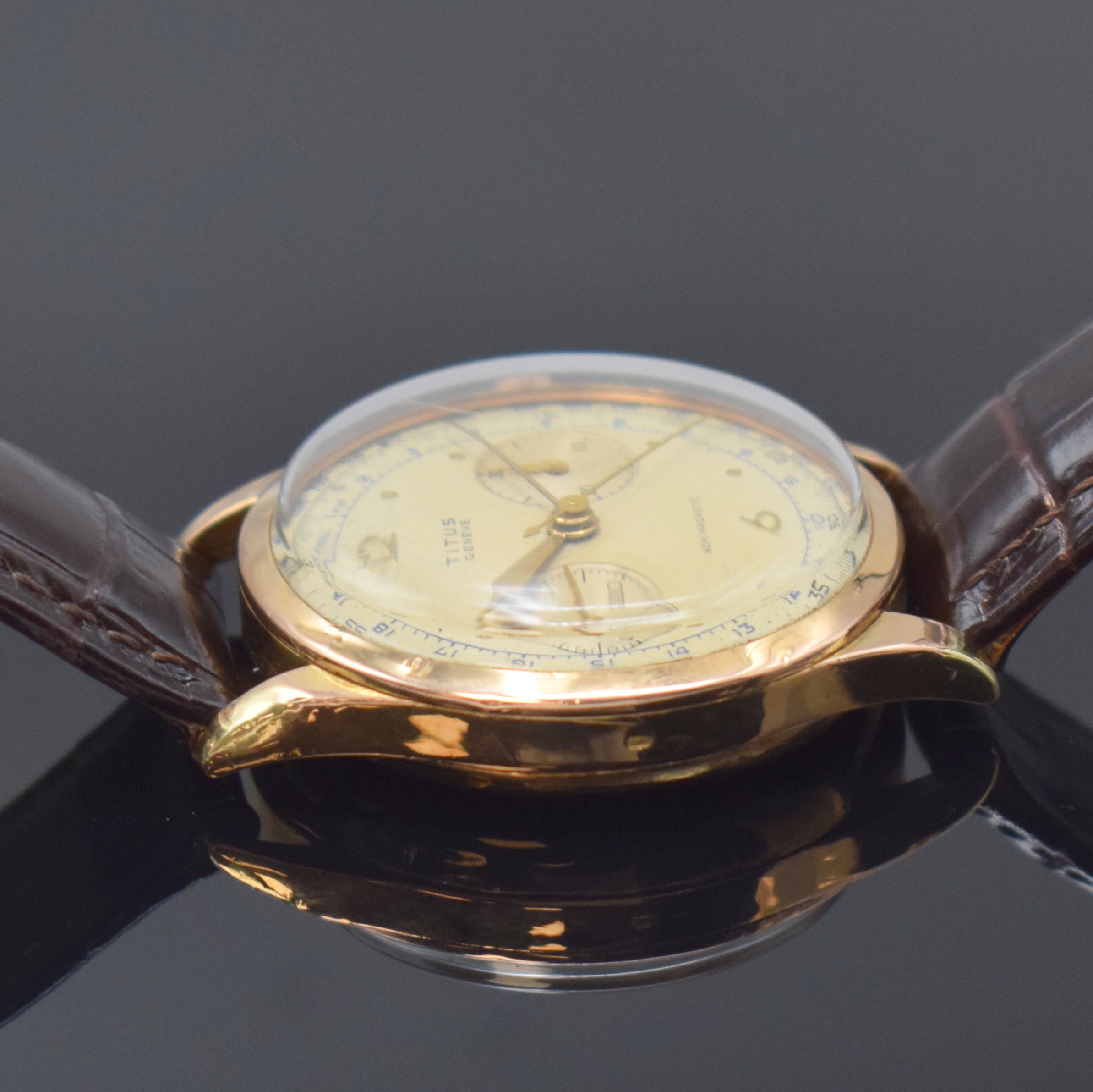 Detail c: TITUS Herrenarmbanduhr mit Chronograph in RG 750/000, Schweiz um 1950, Handaufzug, 3- teil. Geh. dell., Boden und Glasrand aufgedr., verg. Cuv., ...