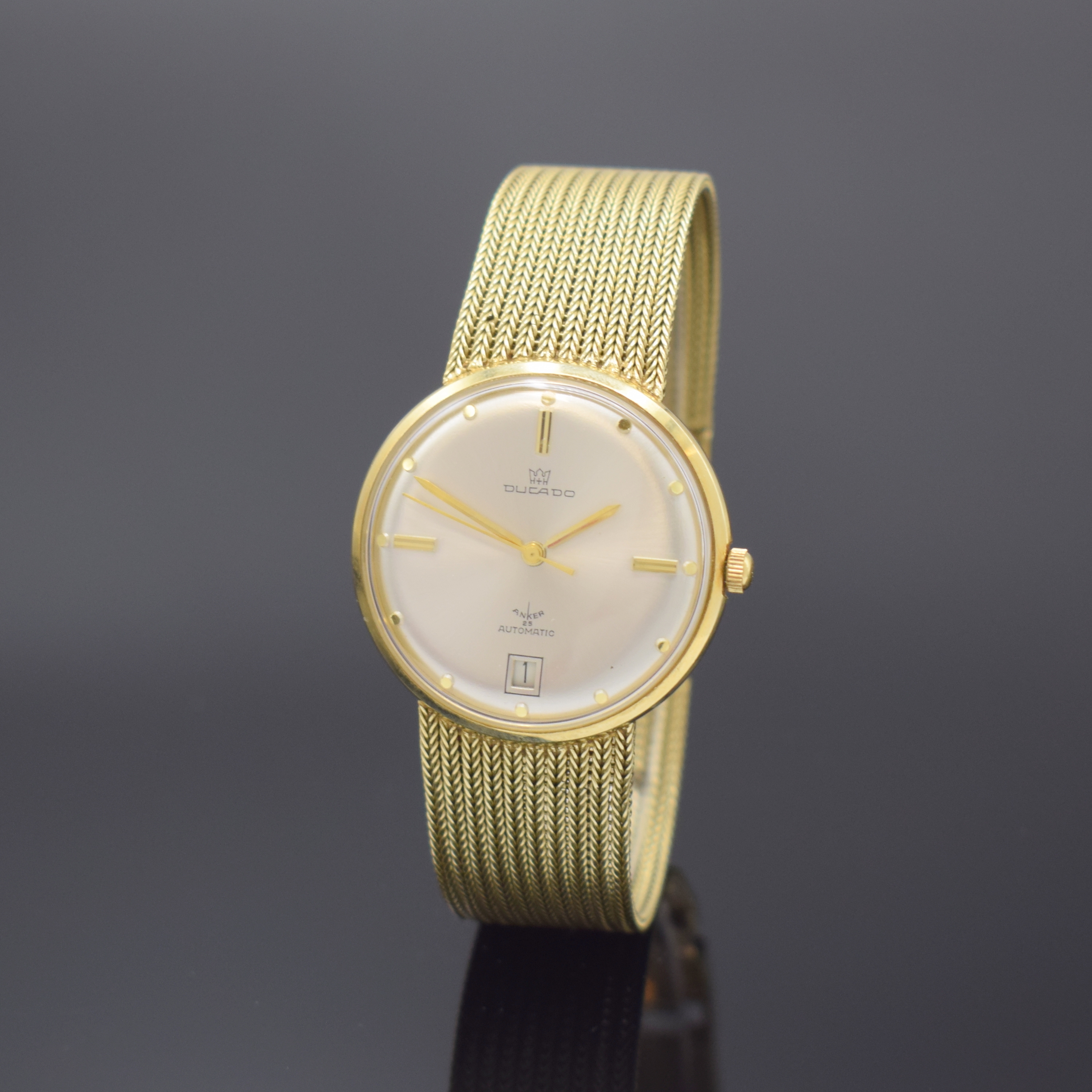 DUCADO Armbanduhr in GG 585/000, Schweiz/Deutschland um 1965, Automatik, Boden aufgedr., silb. Zifferbl. m. gold. Std.-Ind., gold. Zeiger, Datum b. ...