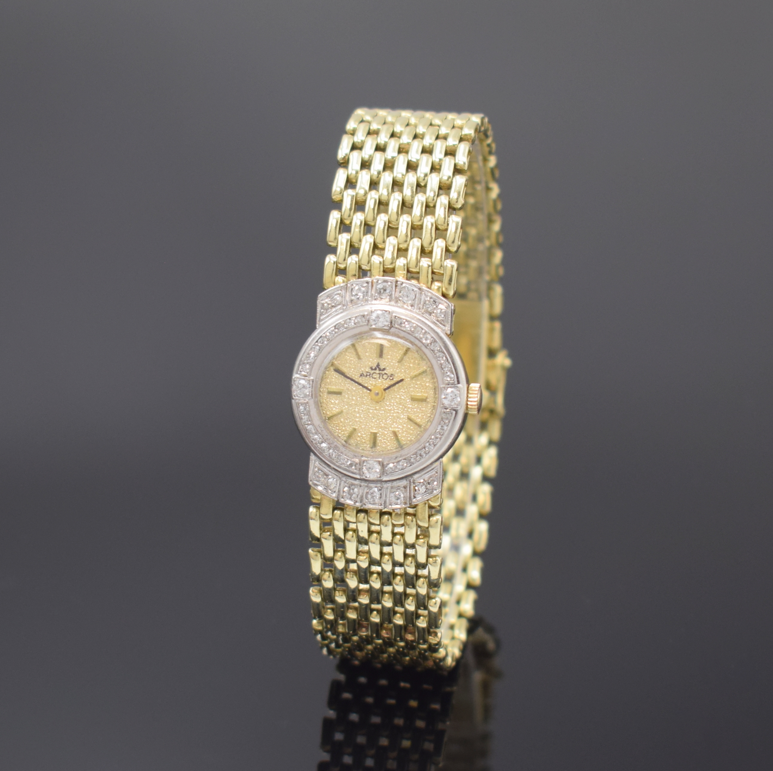 ARCTOS Damenarmbanduhr in GG 585/000 mit Diamanten, Schweiz um 1980, Handaufzug, Ketten-Gliederband mit Kastenschl. und dopp. Sicherheitsacht, ...