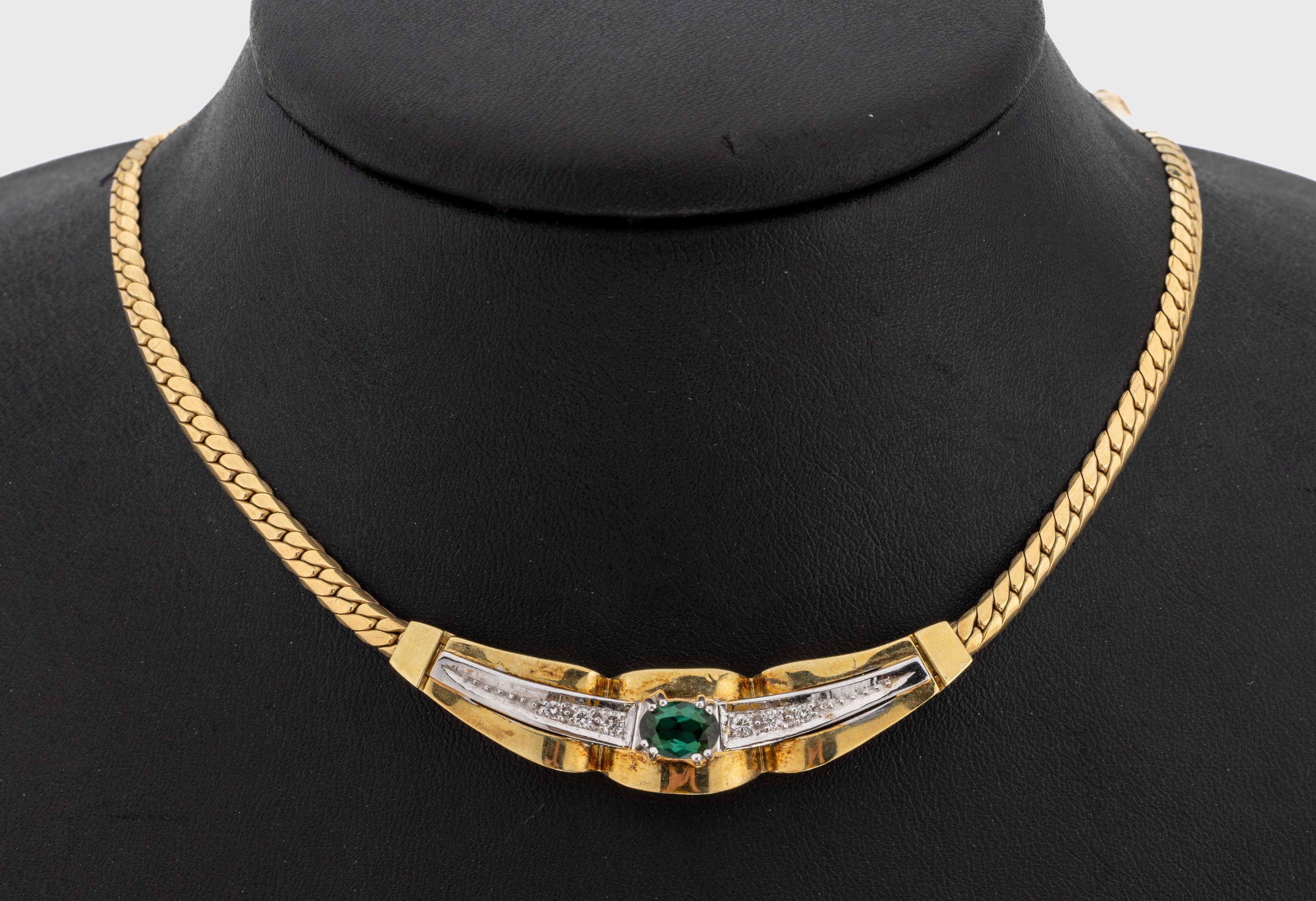14 kt Gold Brillant-Turmalin-Collier, GG/WG 585/000, ovalfacett. Turmalin ca. 0.71 ct, 6 Brillanten zus. ca. 0.13 ct Weiß/si, ca.23.0 g, L. ca. 42 ...