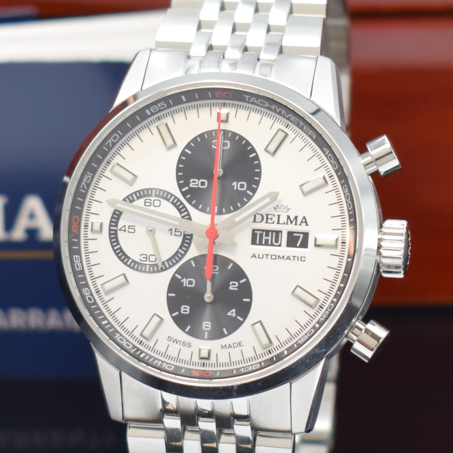 Detail a: DELMA nahezu neuwertiger Armbandchronograph Continental Racing Referenz 110738700000, Automatik, Schweiz um 2024, Edelstahlgeh. inkl. Gliederband m. ...