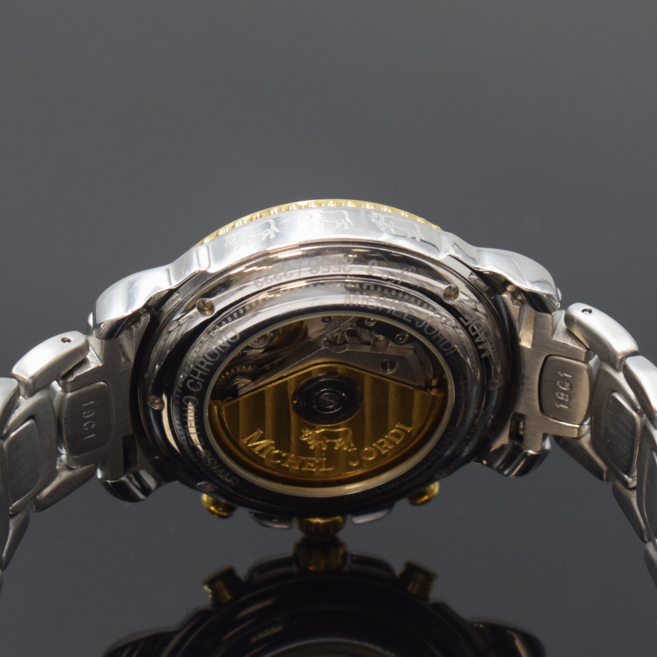 Detail e: MICHEL JORDI Armbandchronograph Ethno Chrono, Automatik, Schweiz um 1991, Edelstahl/Gold komb. inkl. Gliederband m. Faltschl., beids. vergl., Boden ...