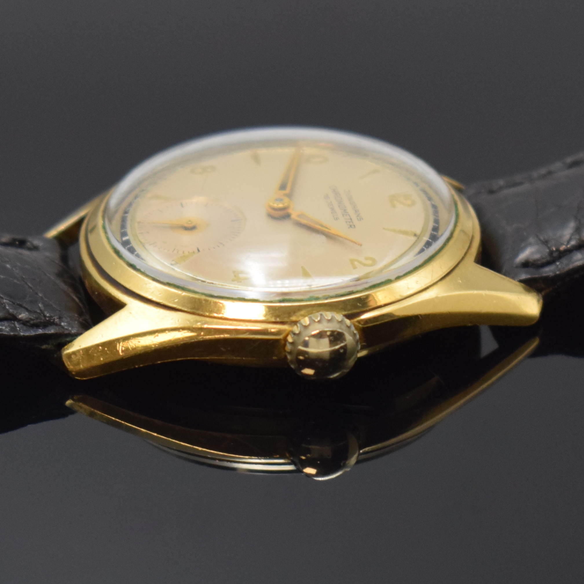 Detail b: JUNGHANS Chronometer Herrenarmbanduhr mit Kaliber 82, Deutschland um 1955, Handaufzug, verg. Gehäuse, Stahlboden geschr., silb. Zifferbl. m. aufges. ...