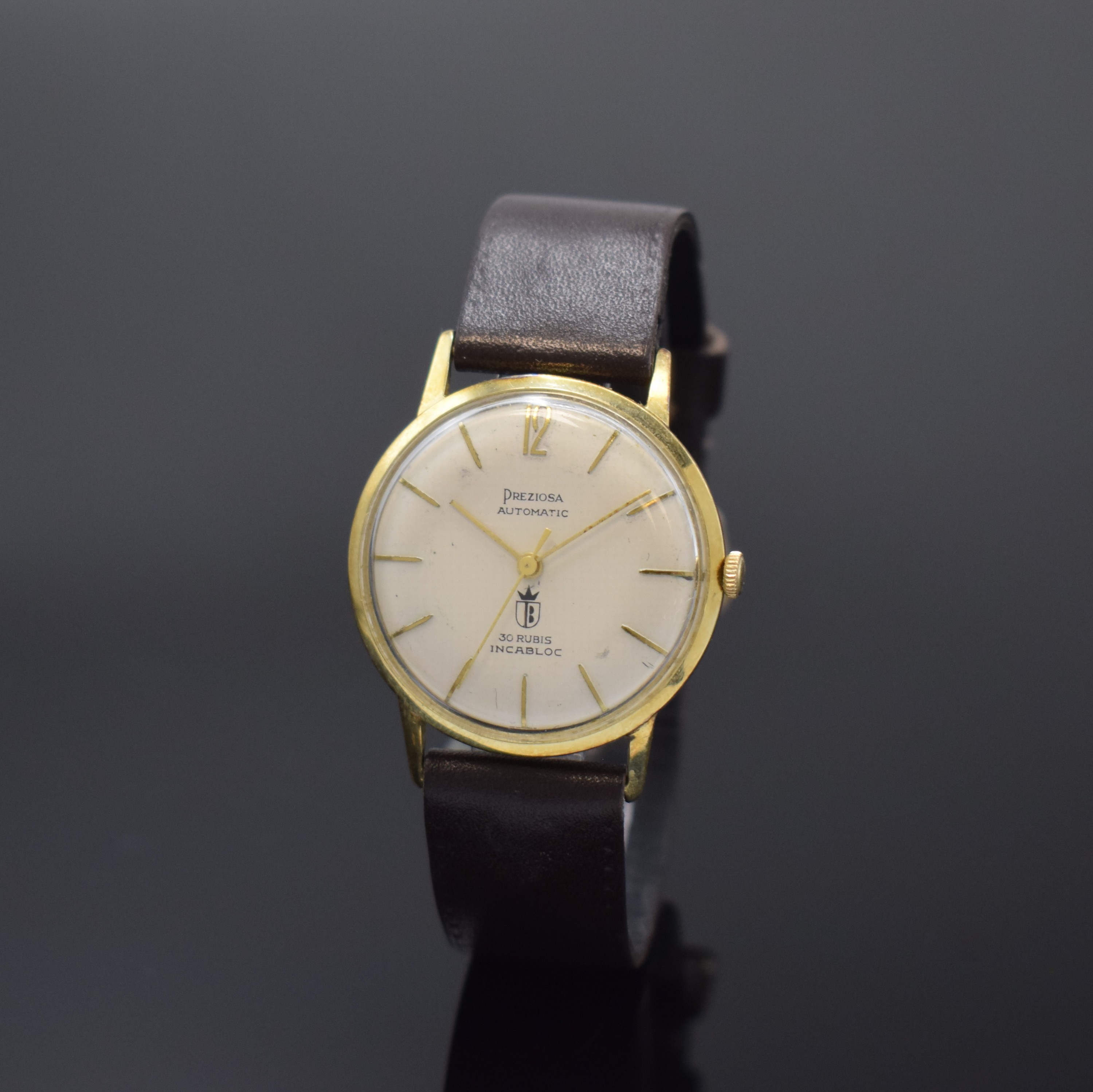 PREZIOSA Armbanduhr in GG 585/000, Schweiz um 1965, Automatik, Boden aufgedr., silb. Zifferbl. teilw. fl., gold. Std.-Ind., gold. Zeiger, Kal. Felsa ...