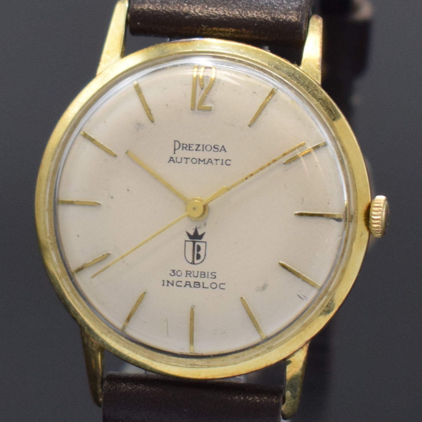 Detail a: PREZIOSA Armbanduhr in GG 585/000, Schweiz um 1965, Automatik, Boden aufgedr., silb. Zifferbl. teilw. fl., gold. Std.-Ind., gold. Zeiger, Kal. Felsa ...