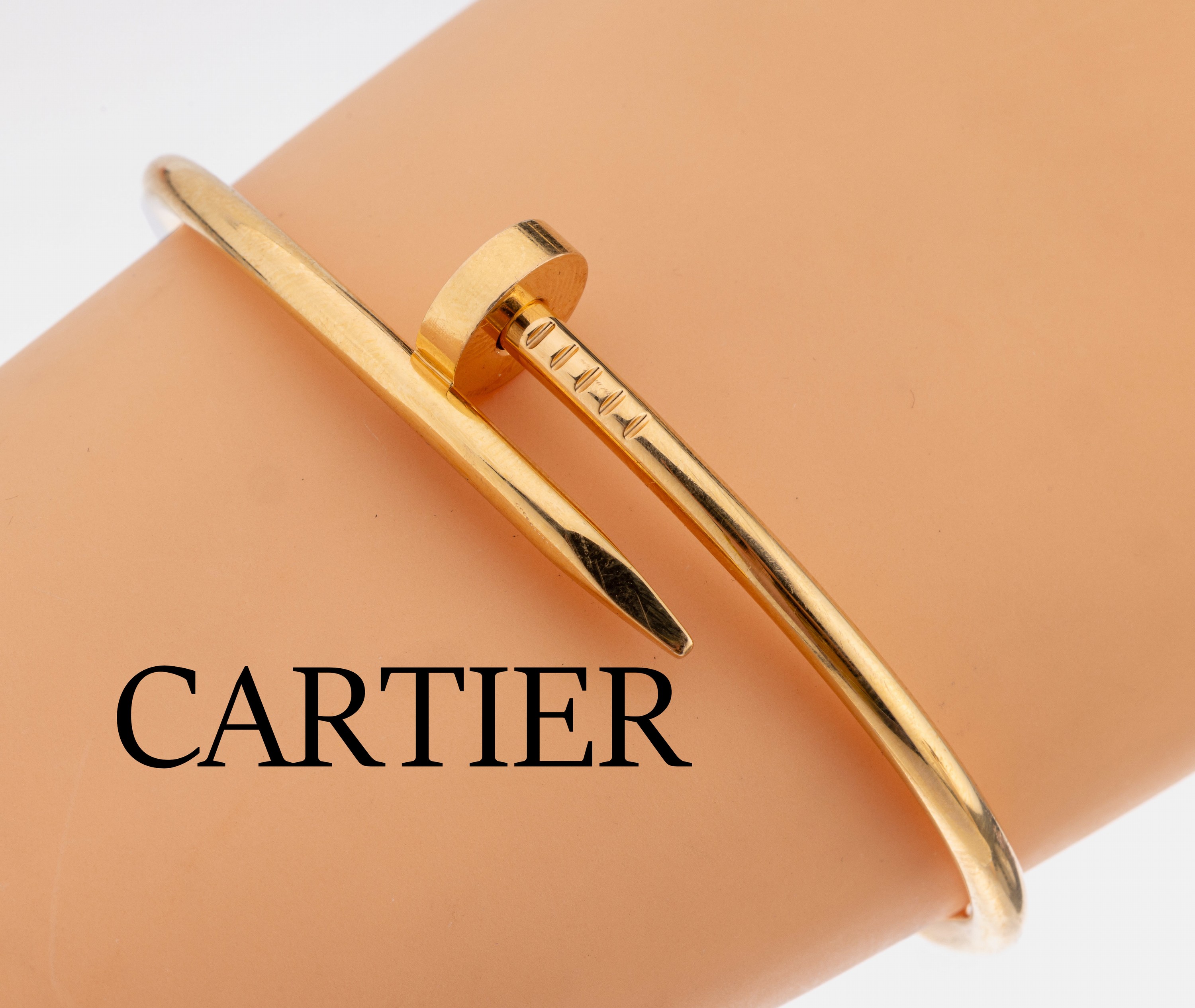 18 kt Gold CARTIER Armreif, GG 750/000, Model "Juste un Clou", D. ca. 5.5 x 6.5 cm (Größe 19), ca. 35.5 g, sign. und num., mit orig. ...