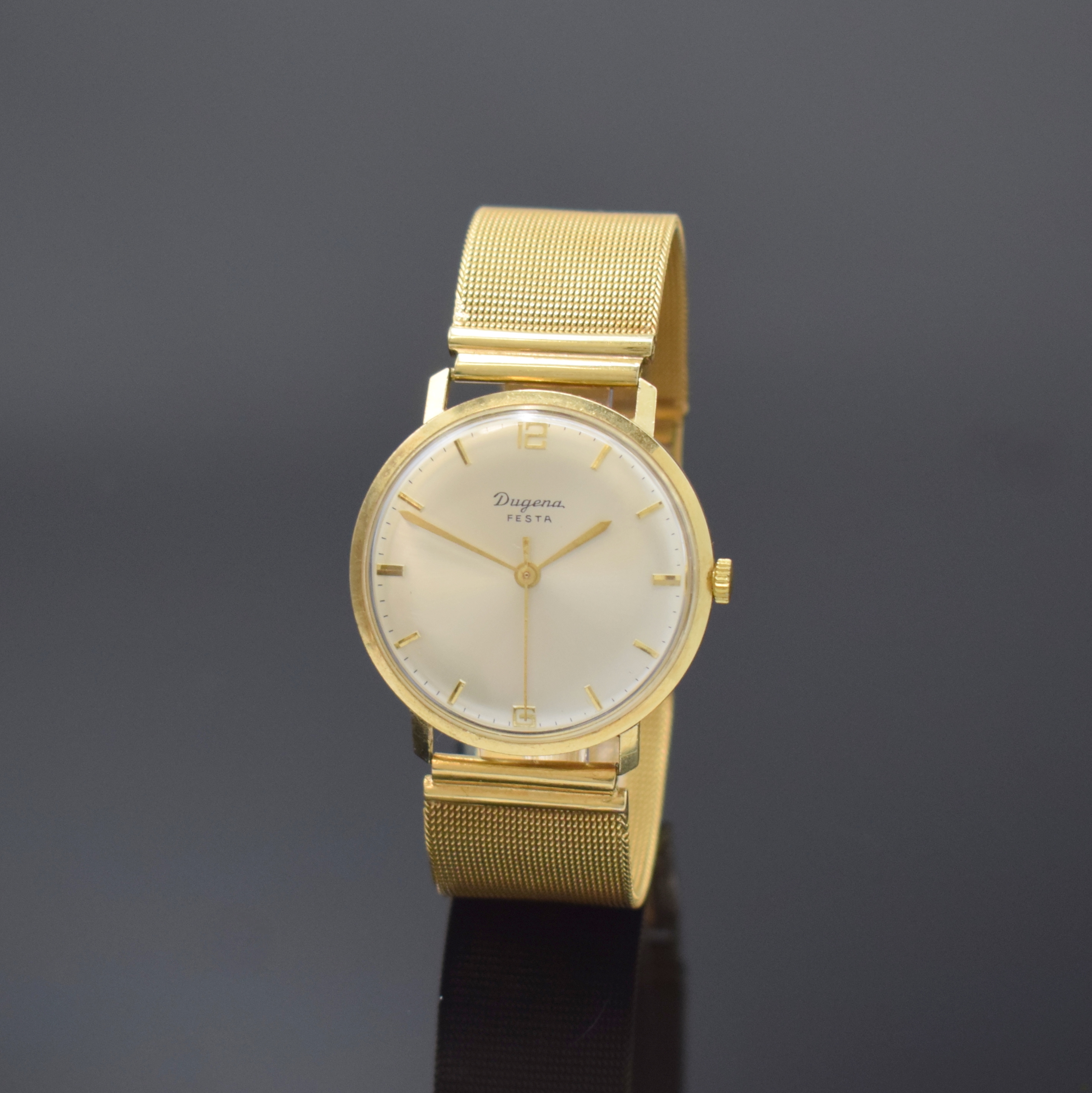 DUGENA Festa Herrenarmbanduhr in GG 585/000, Schweiz um 1965, Handaufzug, Boden aufgedr., Goldband in GG 750/000, silb. Zifferbl. m. gold. Std.-Ind., ...