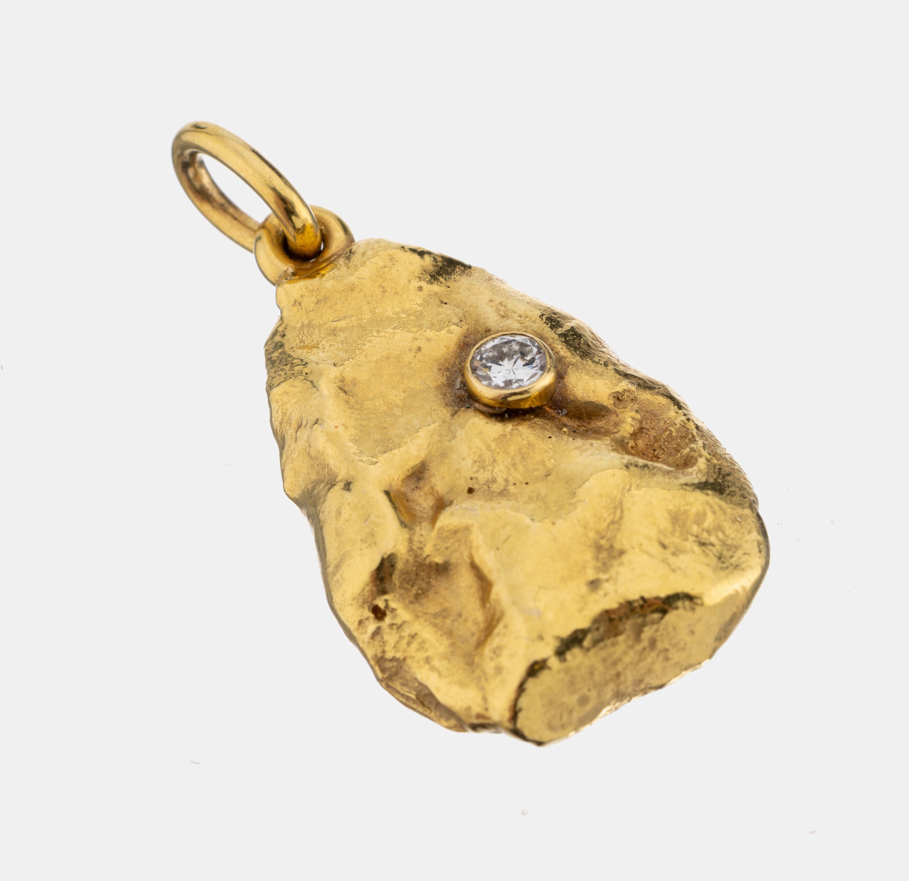 14 kt Gold Brillant-Anhänger, GG 585/000, mehrfach gepr., in Form eines Nuggets, 1 Brillant ca. 0.20 ct Weiß/p, ca. 3.6 x 2 cm, ca. 32.5 g, ...
