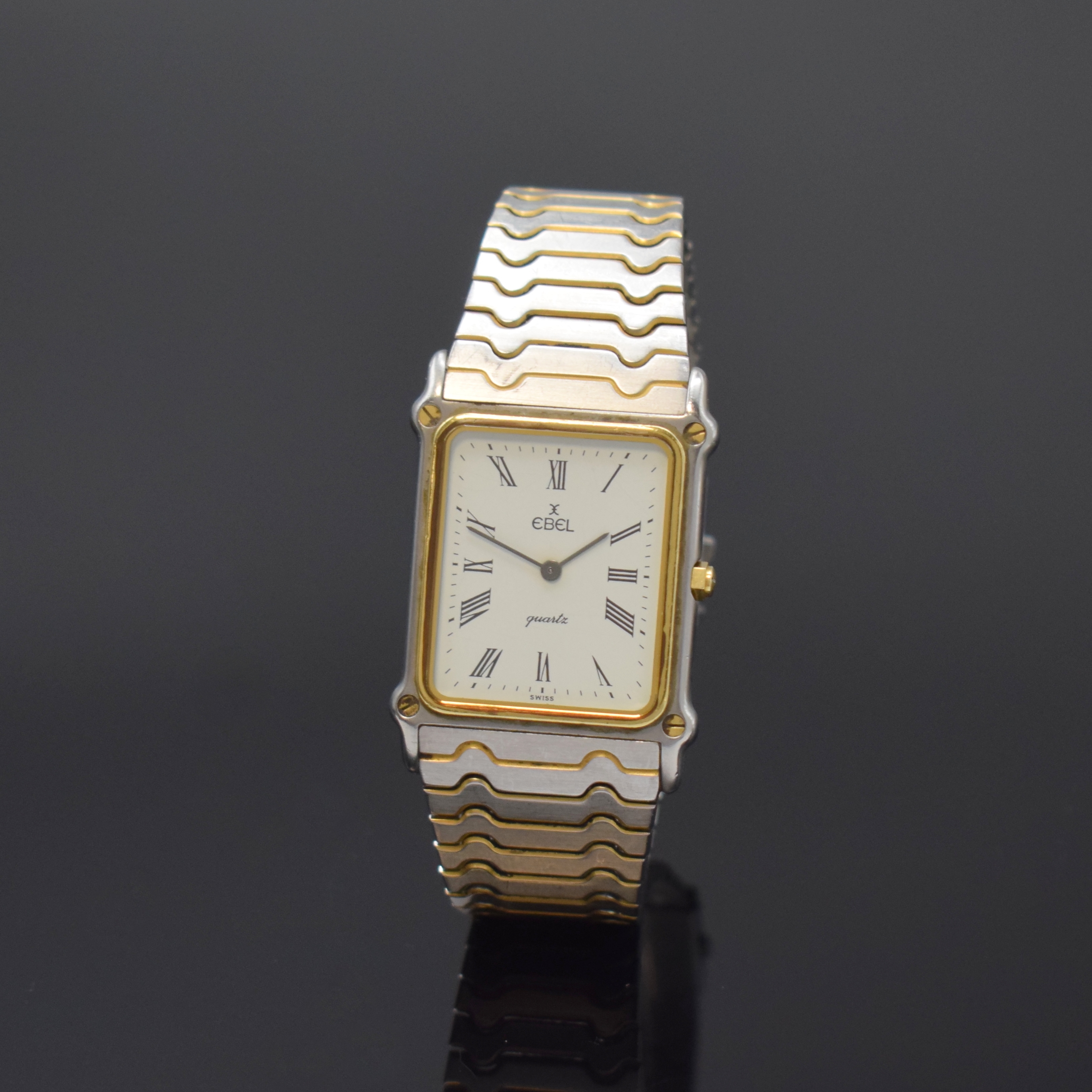 EBEL Armbanduhr in Edelstahl, Schweiz um 1985, quarz, teils verg., Boden 4-fach verschr., orig. Gliederband, weißes Zifferbl. m. röm. Zahlen, ...