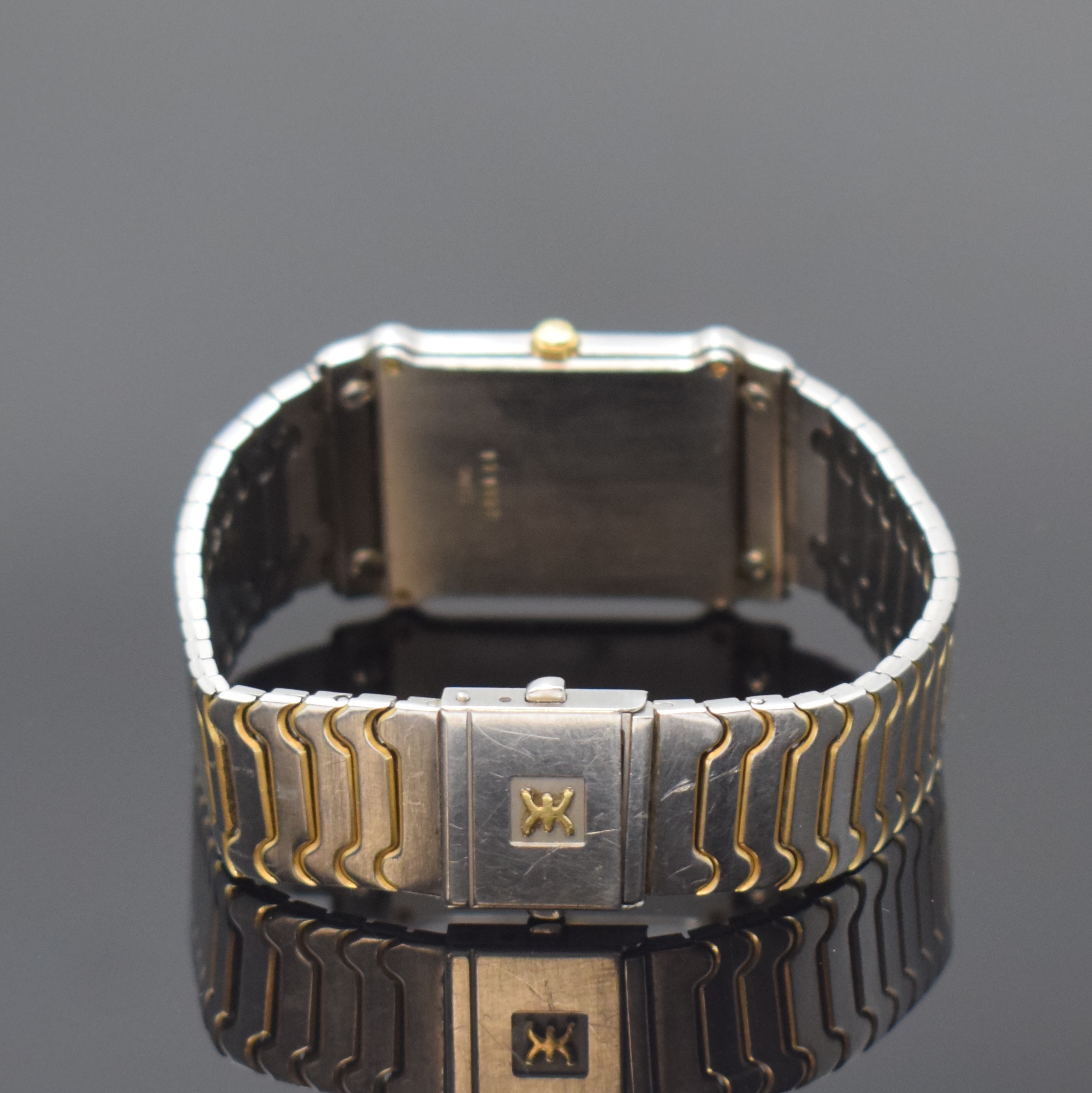 Detail b: EBEL Armbanduhr in Edelstahl, Schweiz um 1985, quarz, teils verg., Boden 4-fach verschr., orig. Gliederband, weißes Zifferbl. m. röm. Zahlen, ...