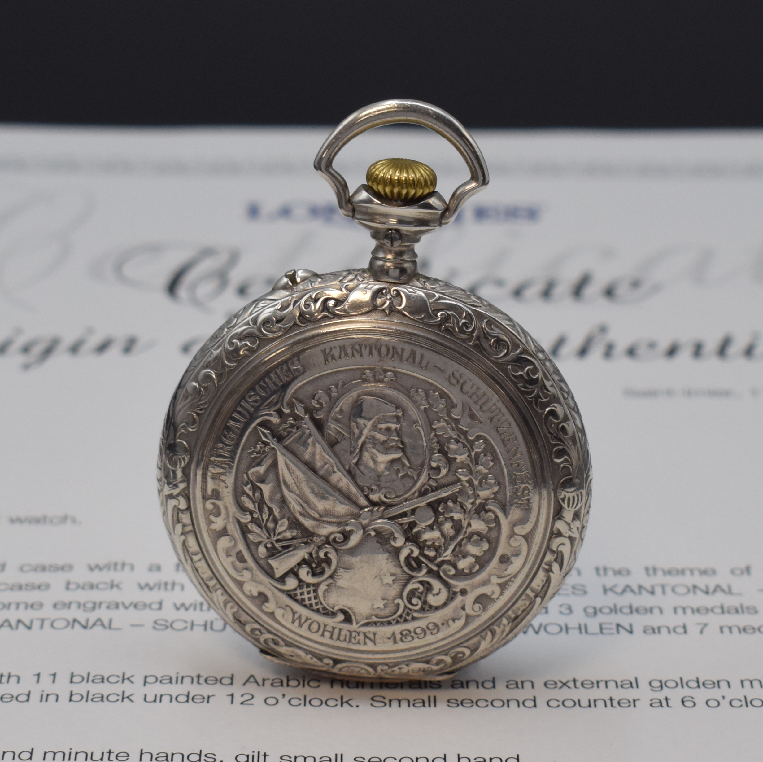 Detail a: LONGINES Schützenuhr Wohlen 1899 in Silber mit Stammbuchauszug, Schweiz 1899, schweres Relief-Geh., rücks. Schützenmotive von Hughe Niners, ...